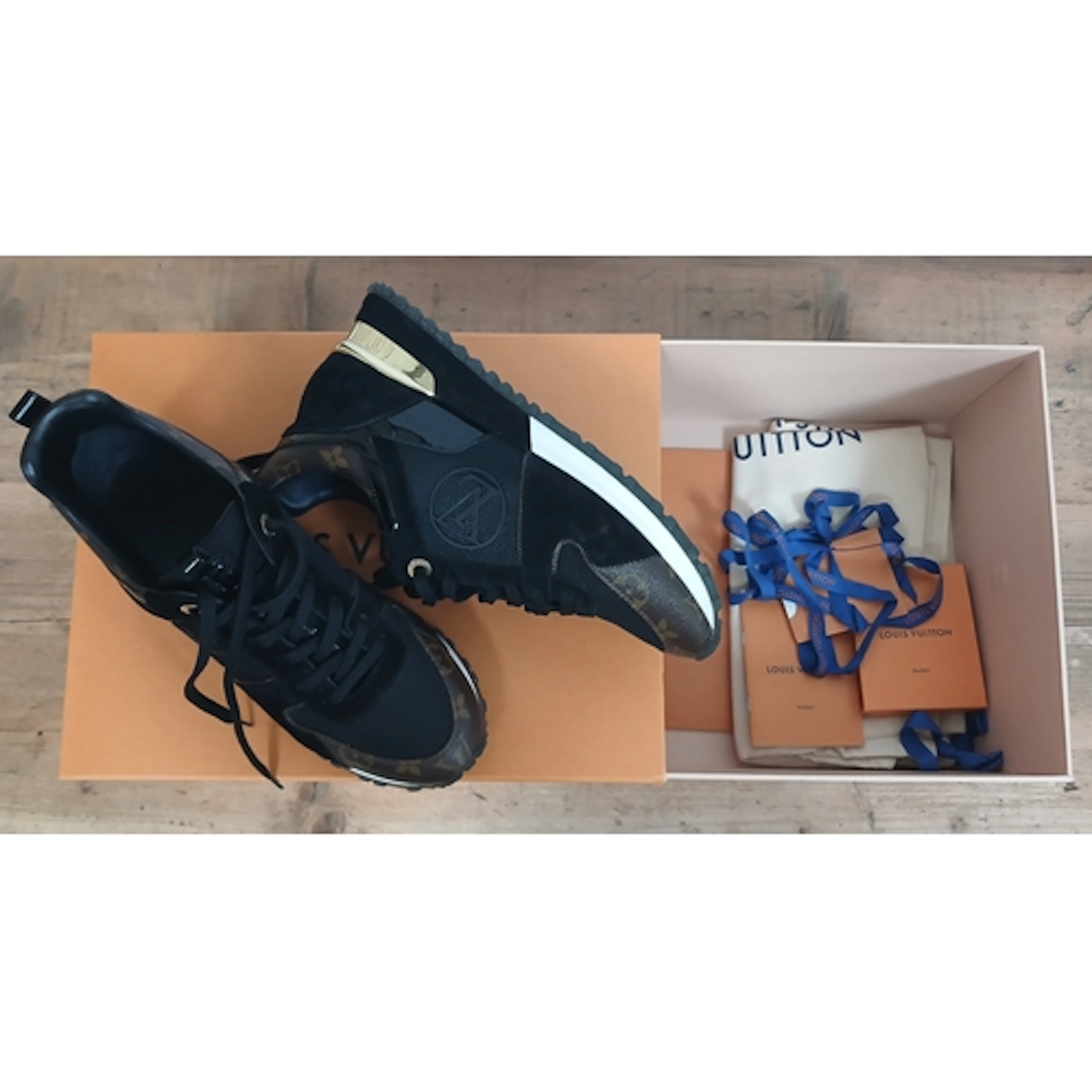 LOUIS VUITTON, a pair of trainers, size 39.5, boxed with sof...