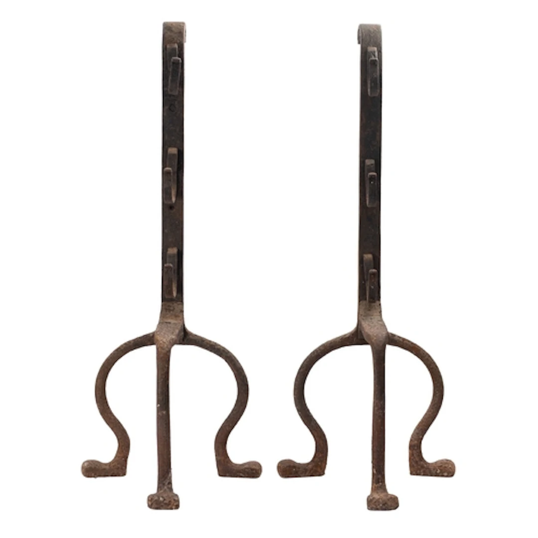 A pair of substantial wrought iron andirons, late 19th /earl...