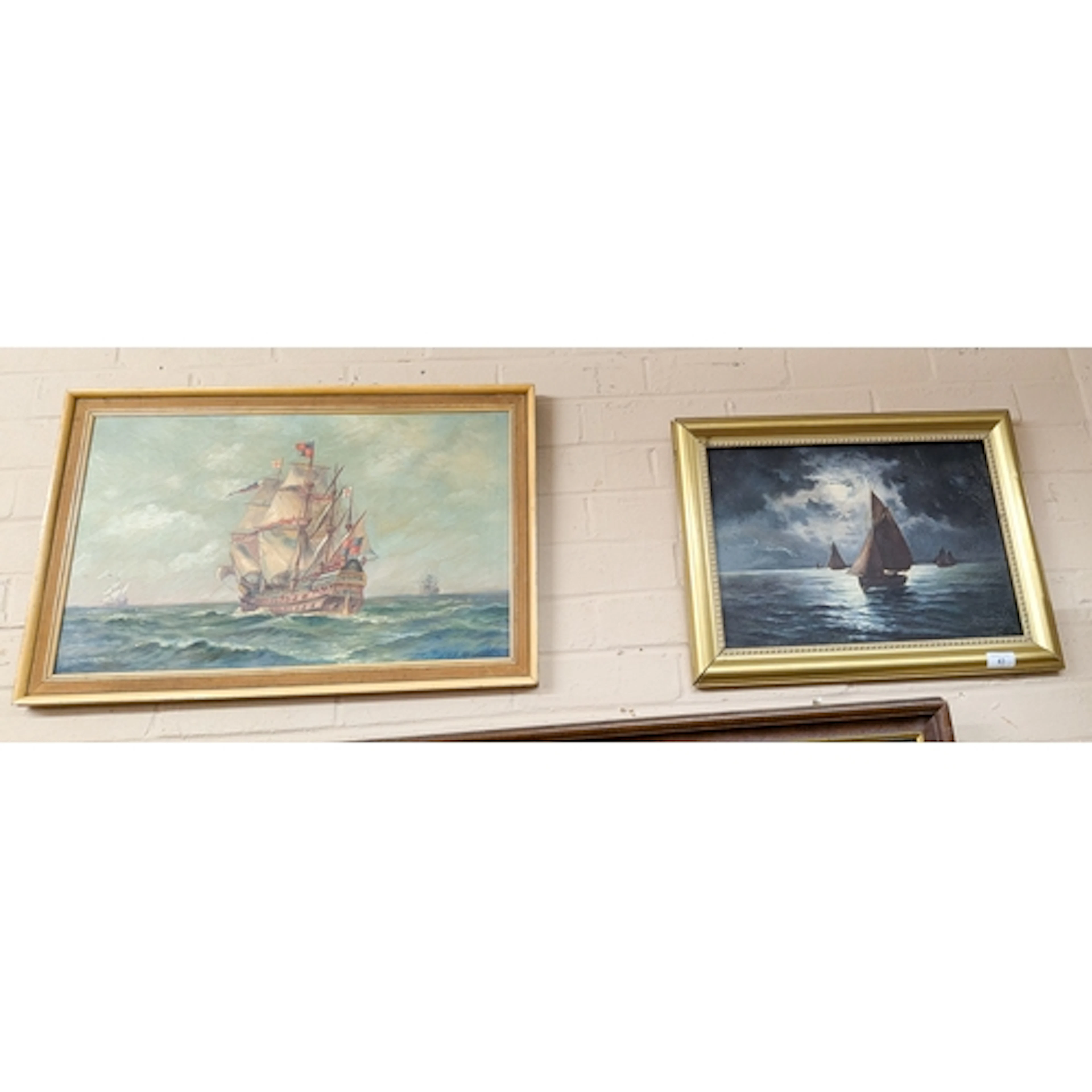 Framed oil painting of a sailing galleon and another maritim...