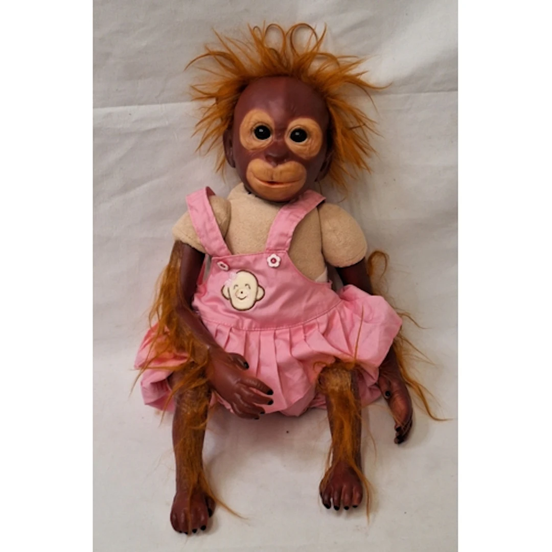 Vintage Baby Orangutang Toy/Doll Wearing a pink dress approx...