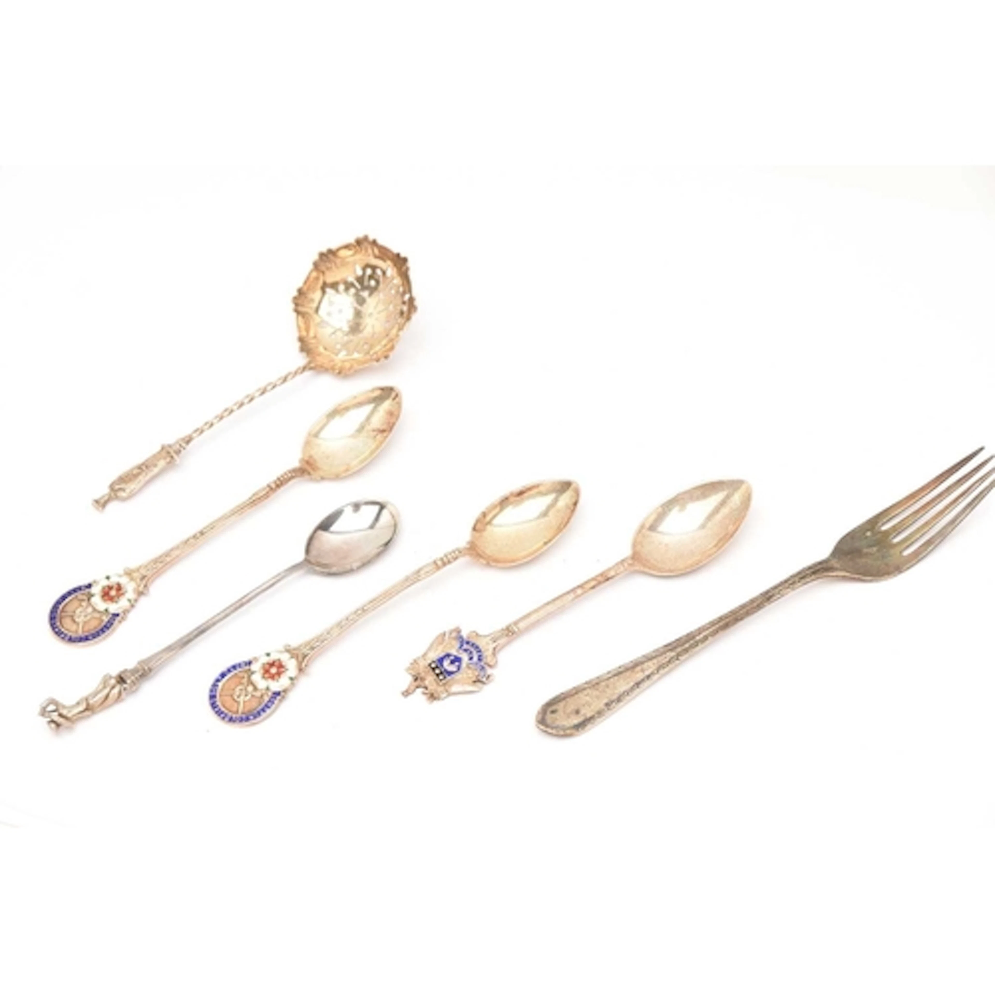 AN ASSORTMENT OF SILVER CUTLERY, to include an apostle top s...