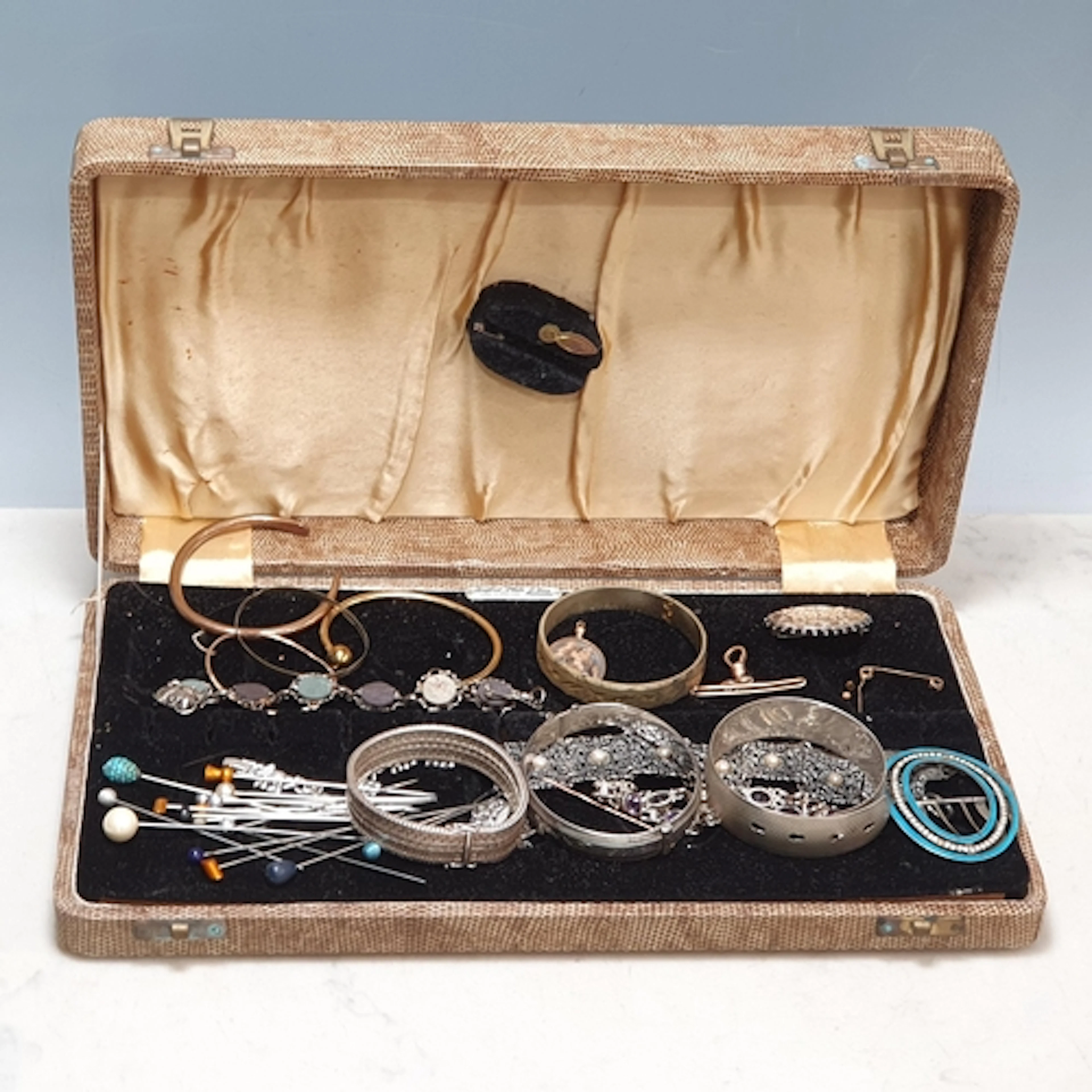 A hinged silver Bangle and two others, a Stick Pin set seed ...