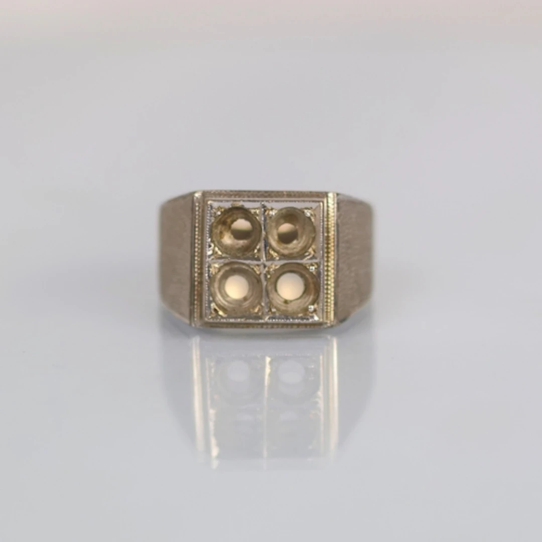 A late 20th century white metal ring mount, the square head ...