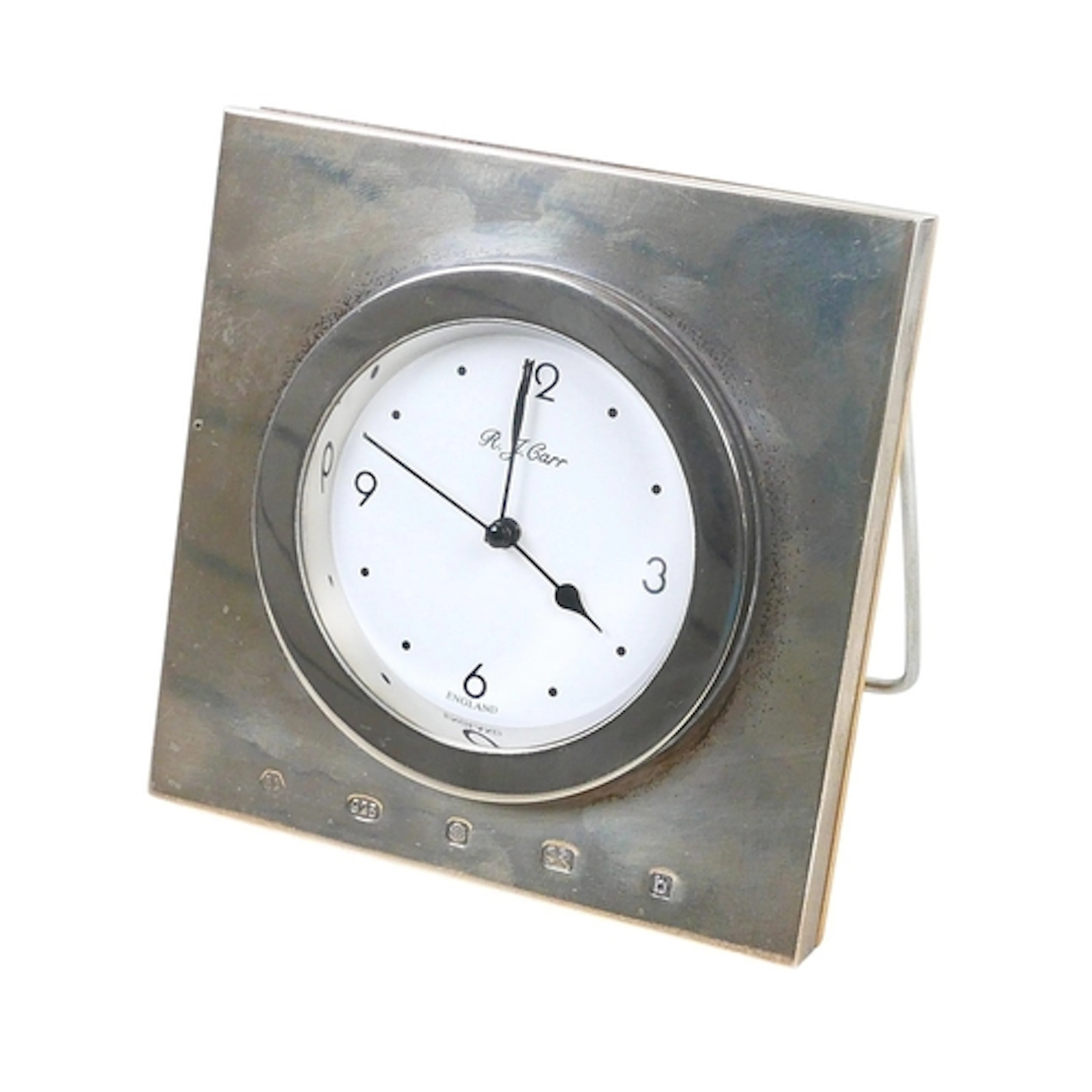 A ELIZABETH II SILVER MOUNTED TRAVEL CLOCK. with wooden back...
