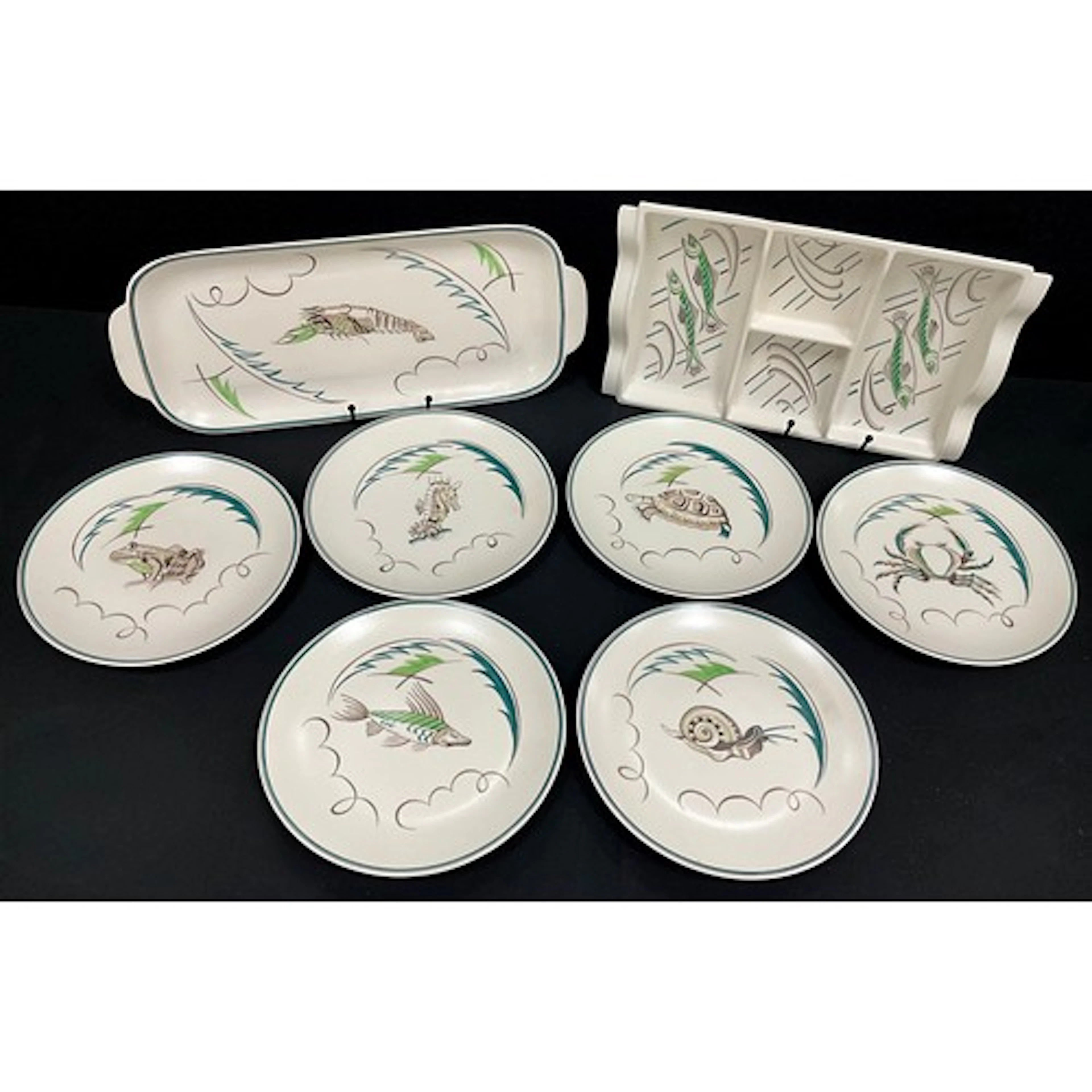 A Poole pottery hors d'oeuvres fish serving dish, similar tr...