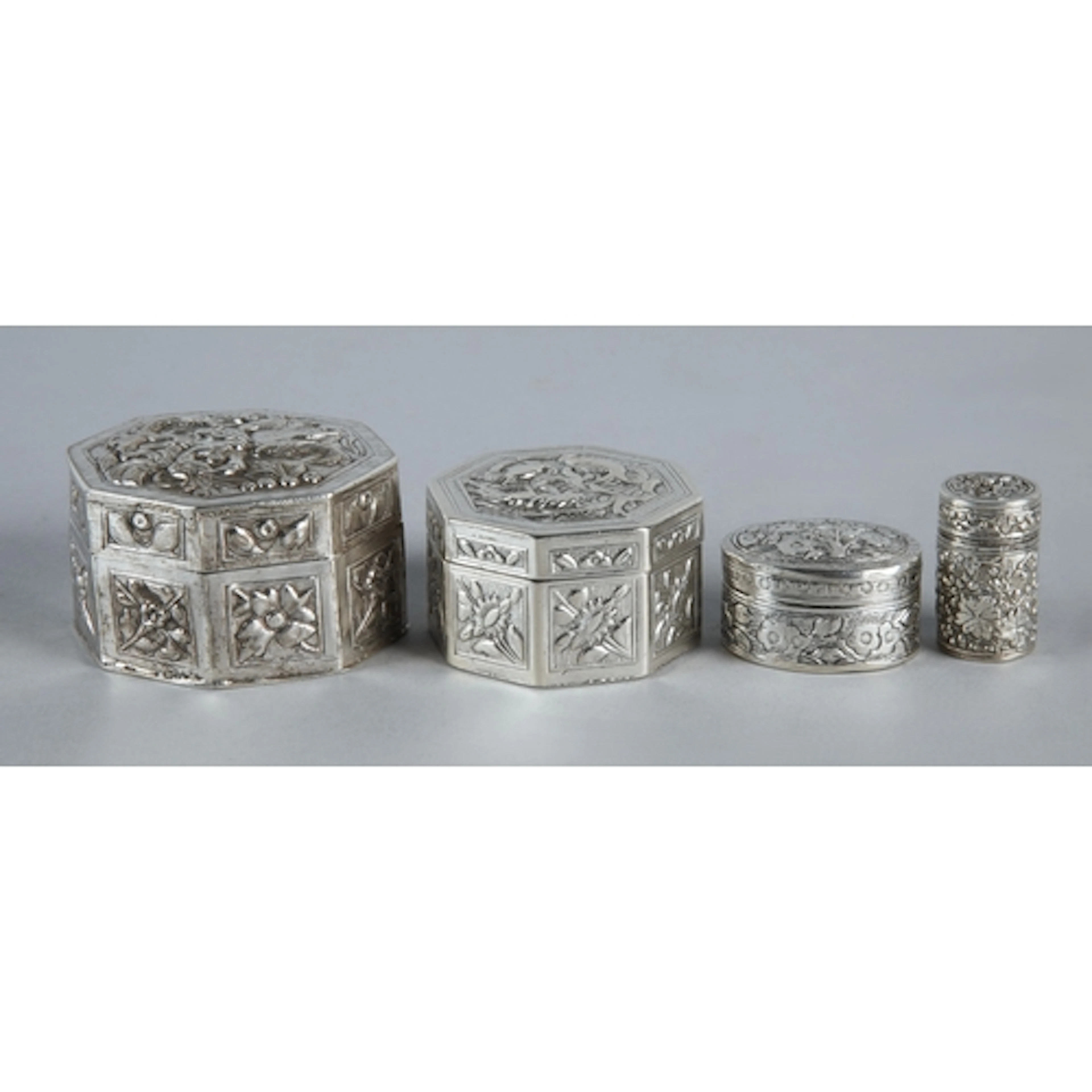 Two Chinese style export silver octagonal trinket boxes with...