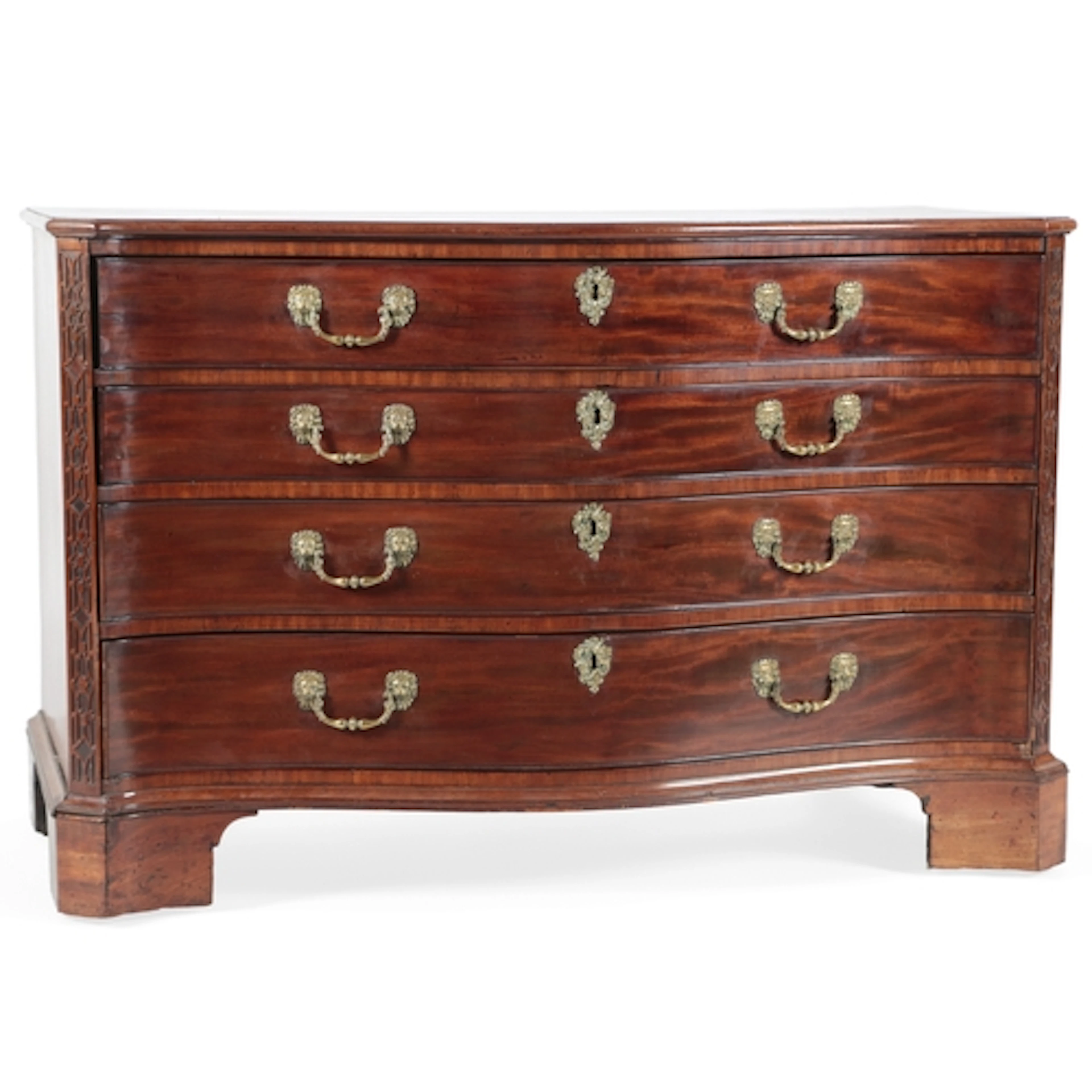 A George III mahogany serpentine dressing chest, in the mann...