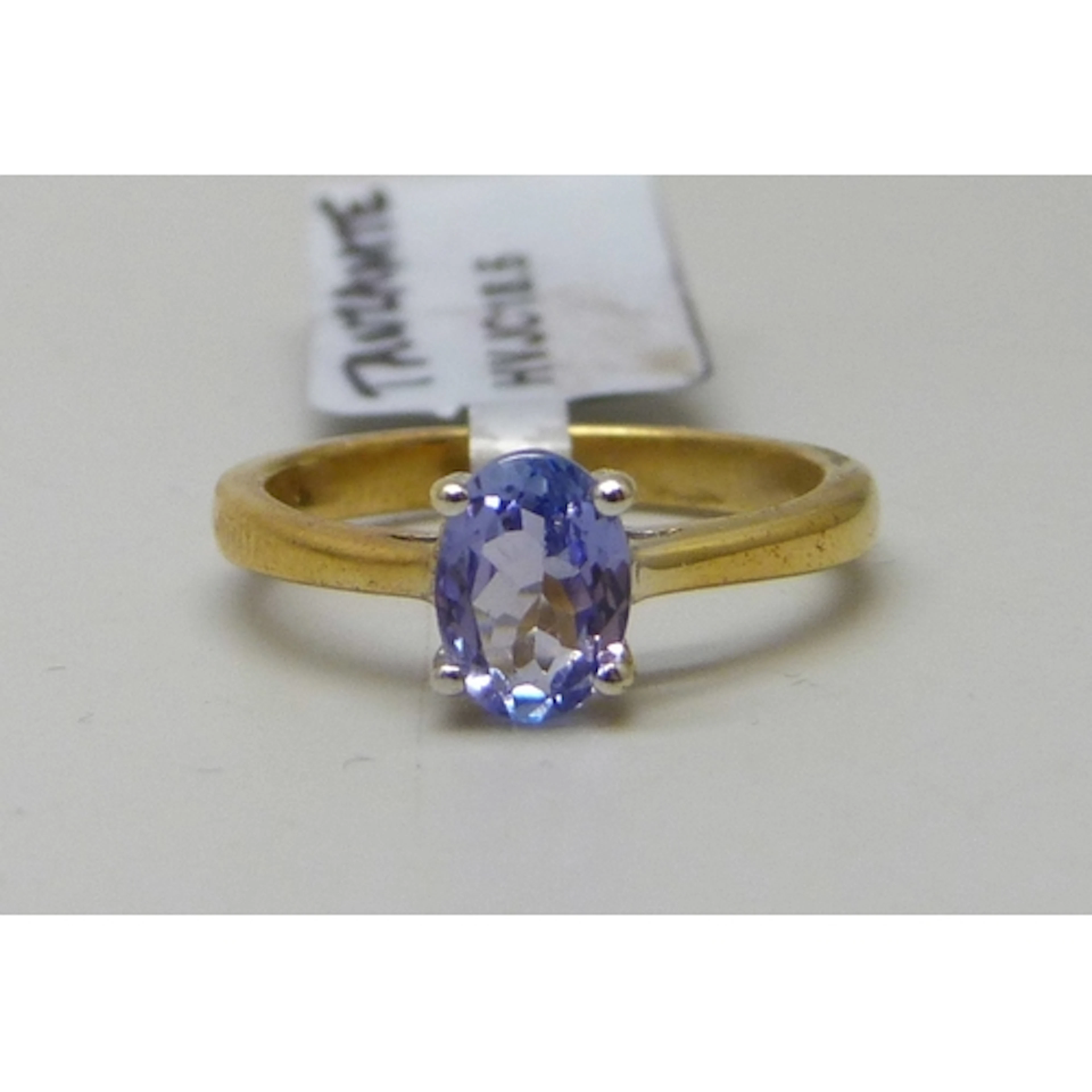 A TGGC silver gilt tanzanite solitaire ring, J