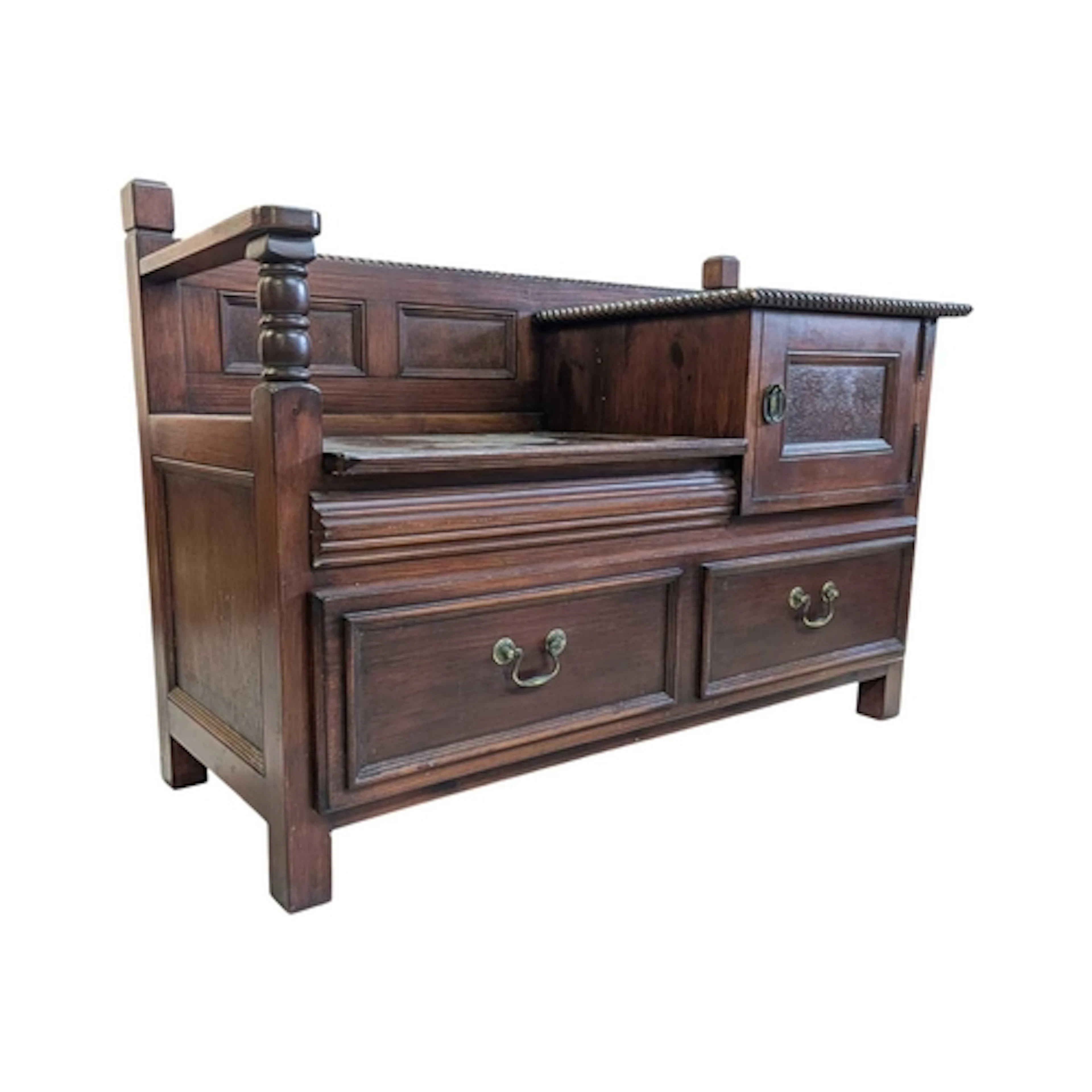 A Jacobean revival mahogany hall telephone table. Panelled b...