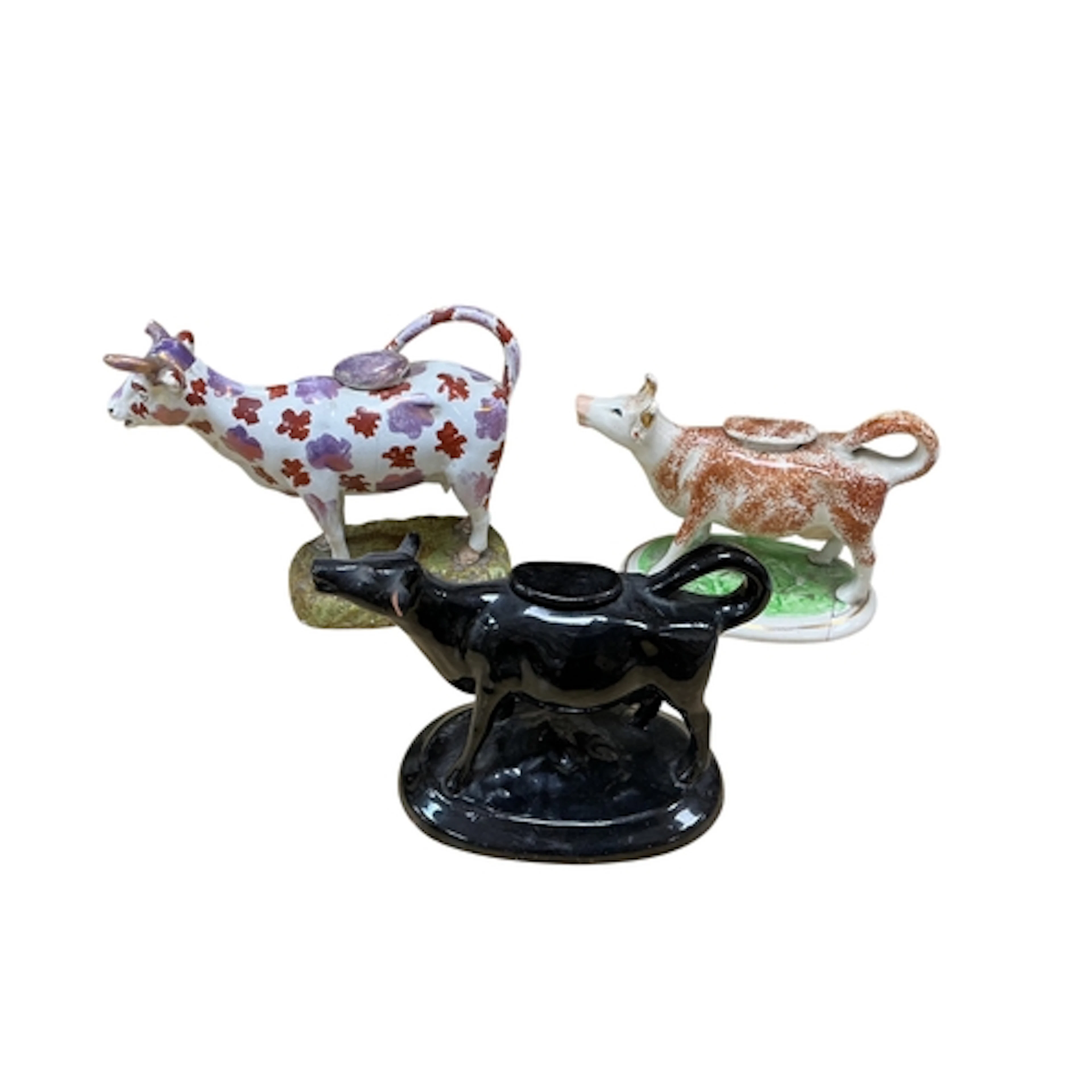 Three 19th century Staffordshire cow creamers