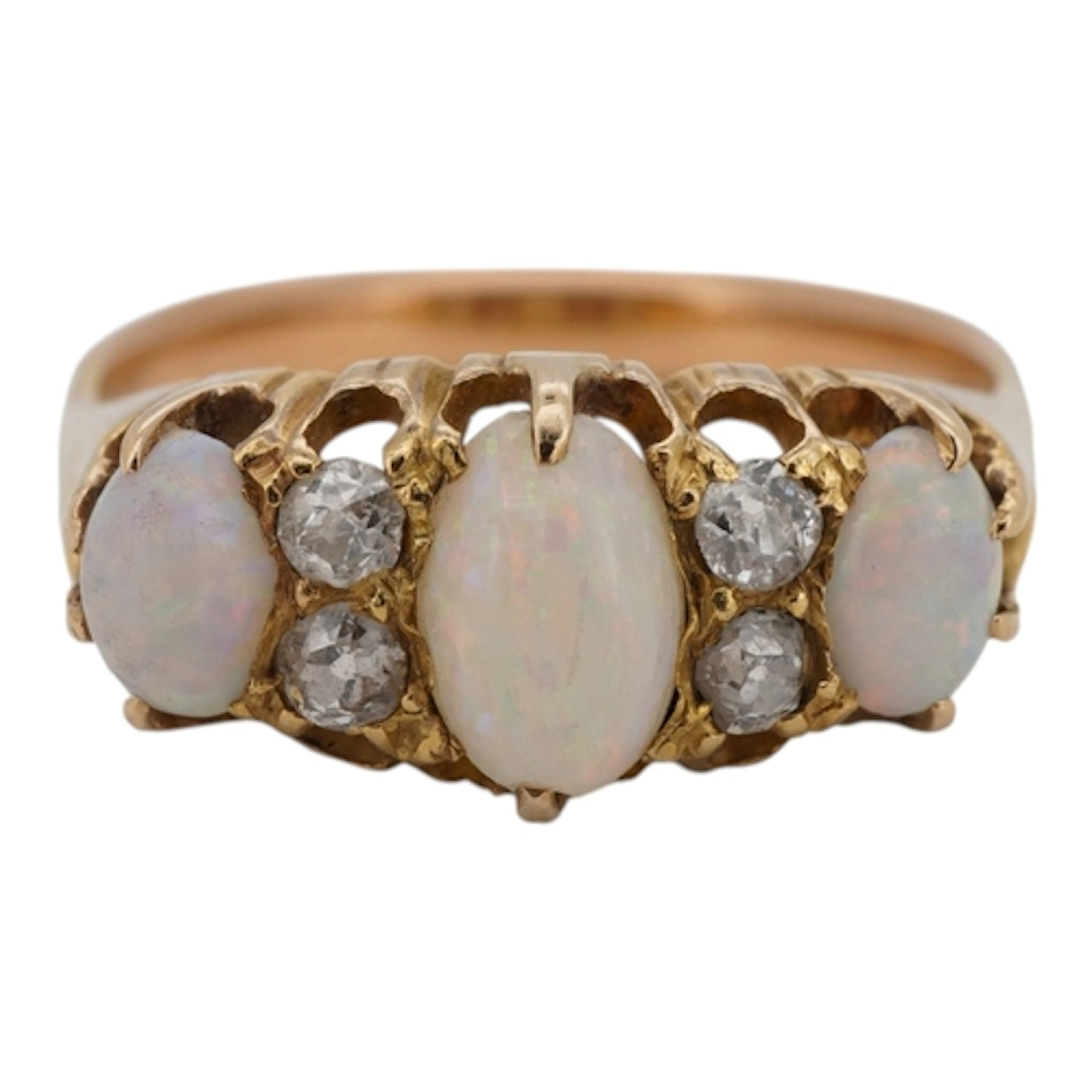 A yellow metal and three stone white opal set ring, with fou...