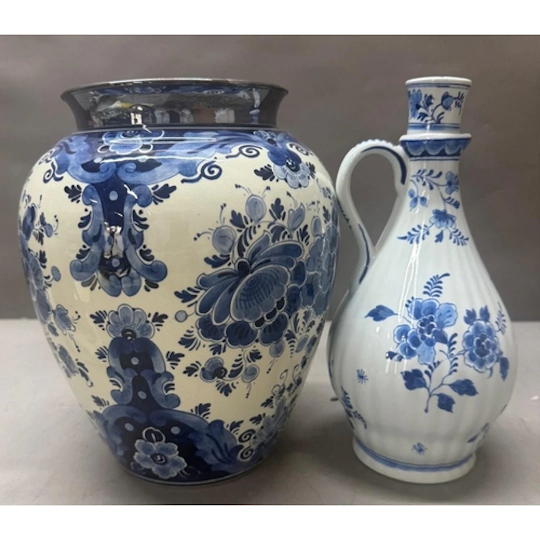 A Delft ware vase with silver rim together with a Delft pitc...