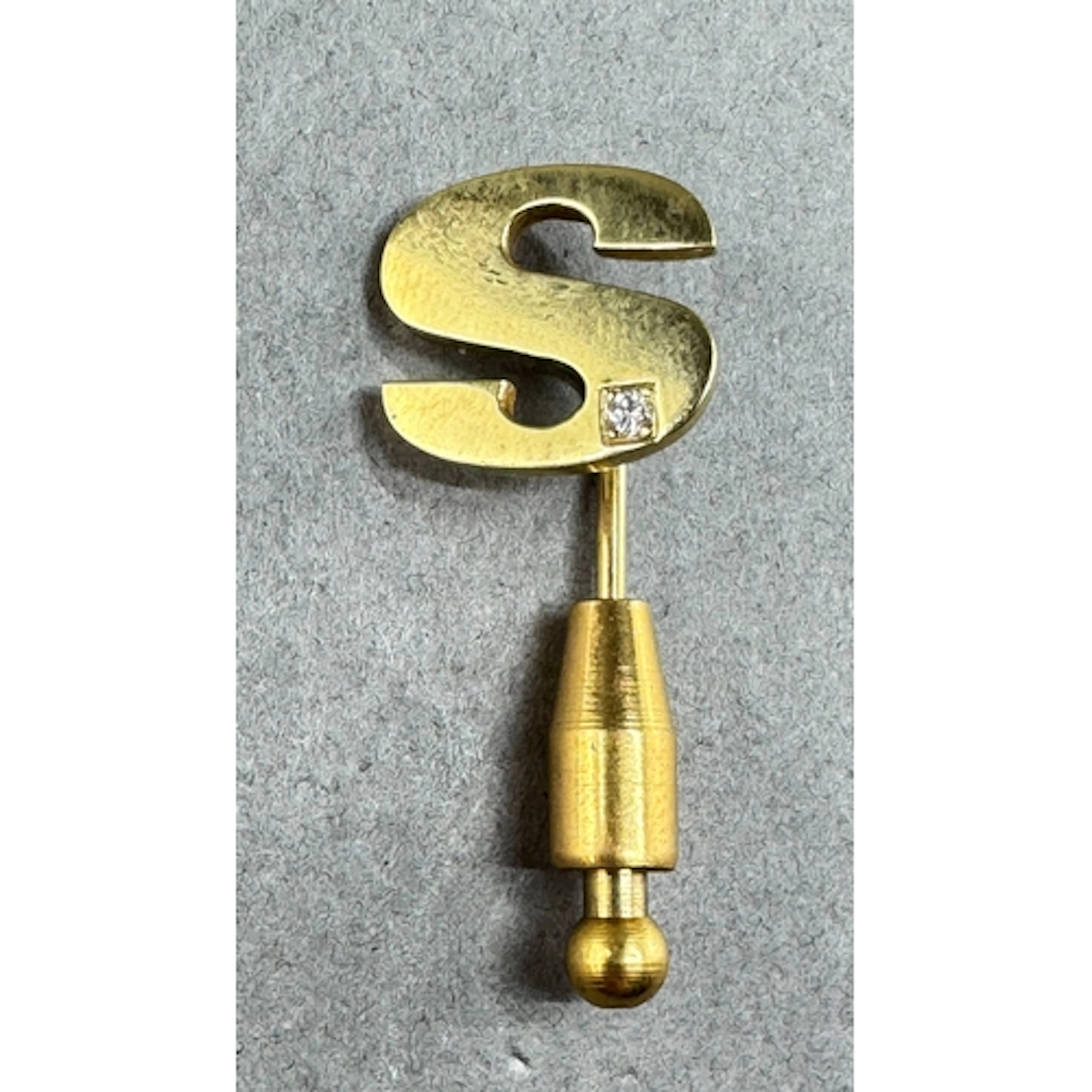 Jewellery- 9ct Gold and diamond set letter 'S' stick/tie pin...