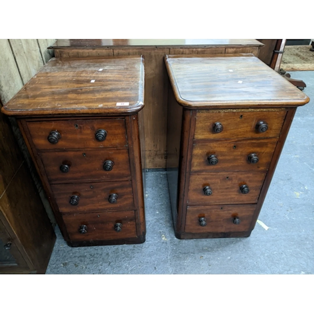 A pair of Victorian mahogany four drawer bedside cabinets, t...