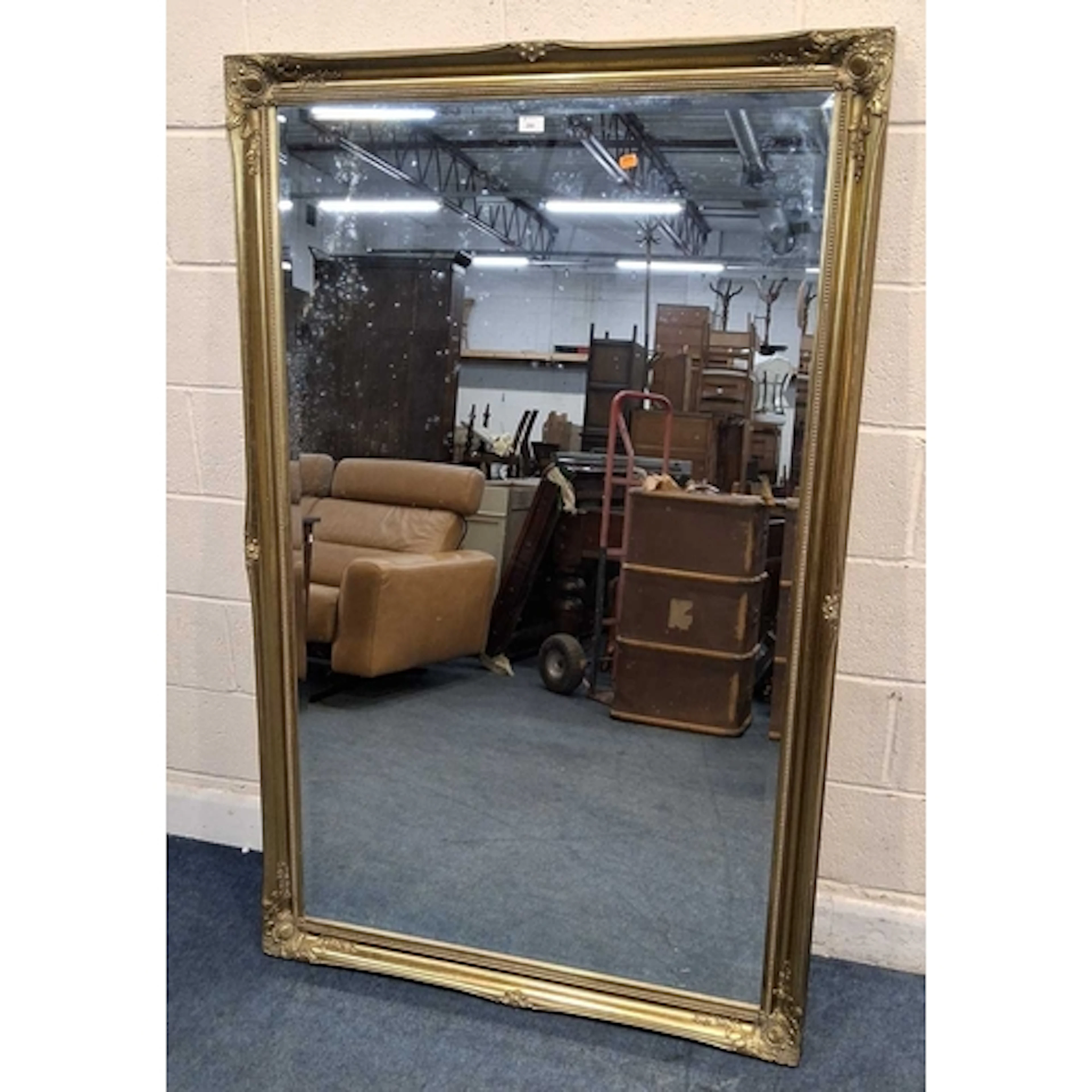 A LARGE GILT WOOD RECTANGULAR BEVELLED EDGE WALL MIRROR, wit...