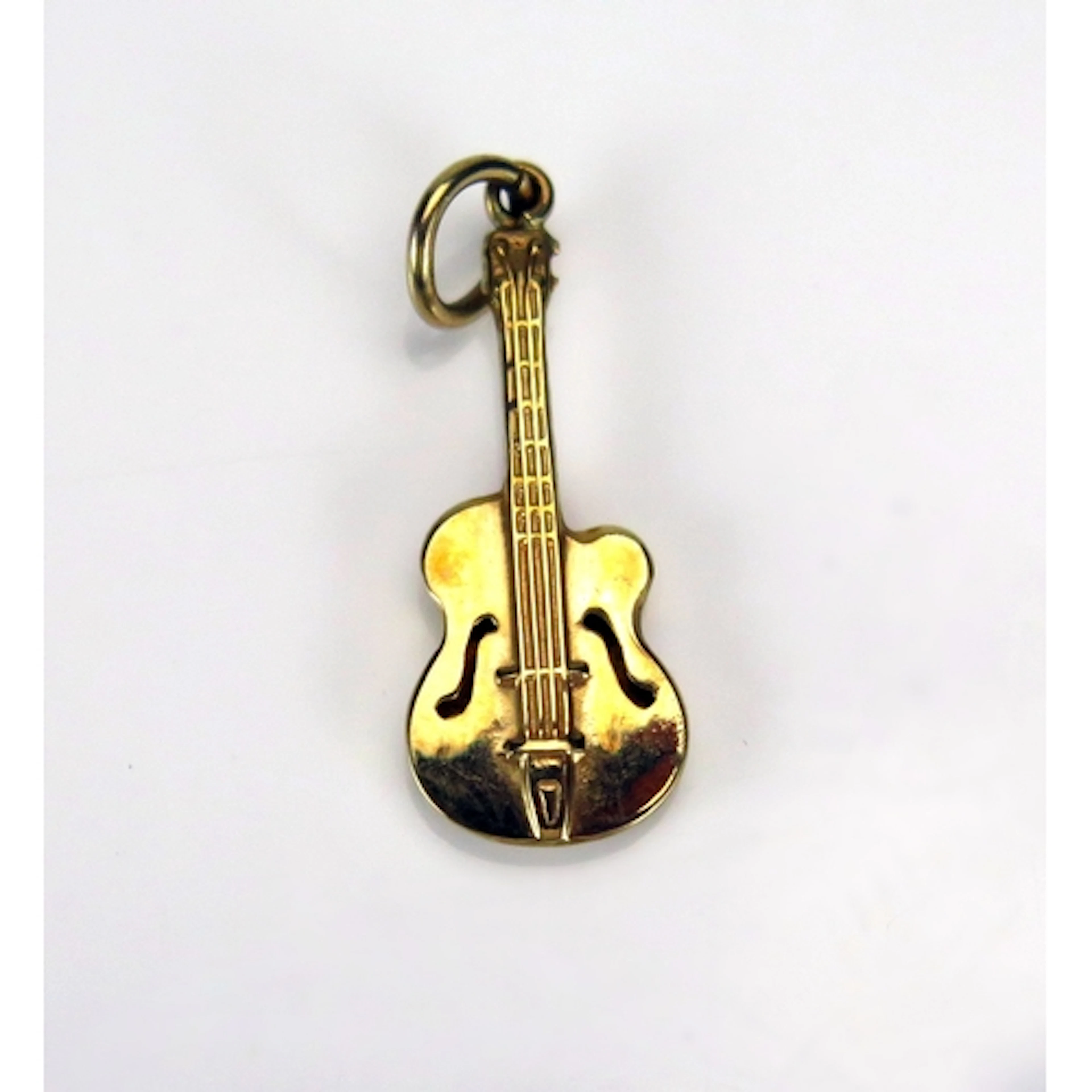 A 9ct gold guitar charm, hallmarked, 0.63g