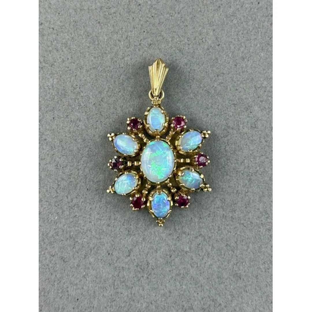 Jewellery: a yellow metal snowflake pendant, marked 375 and ...