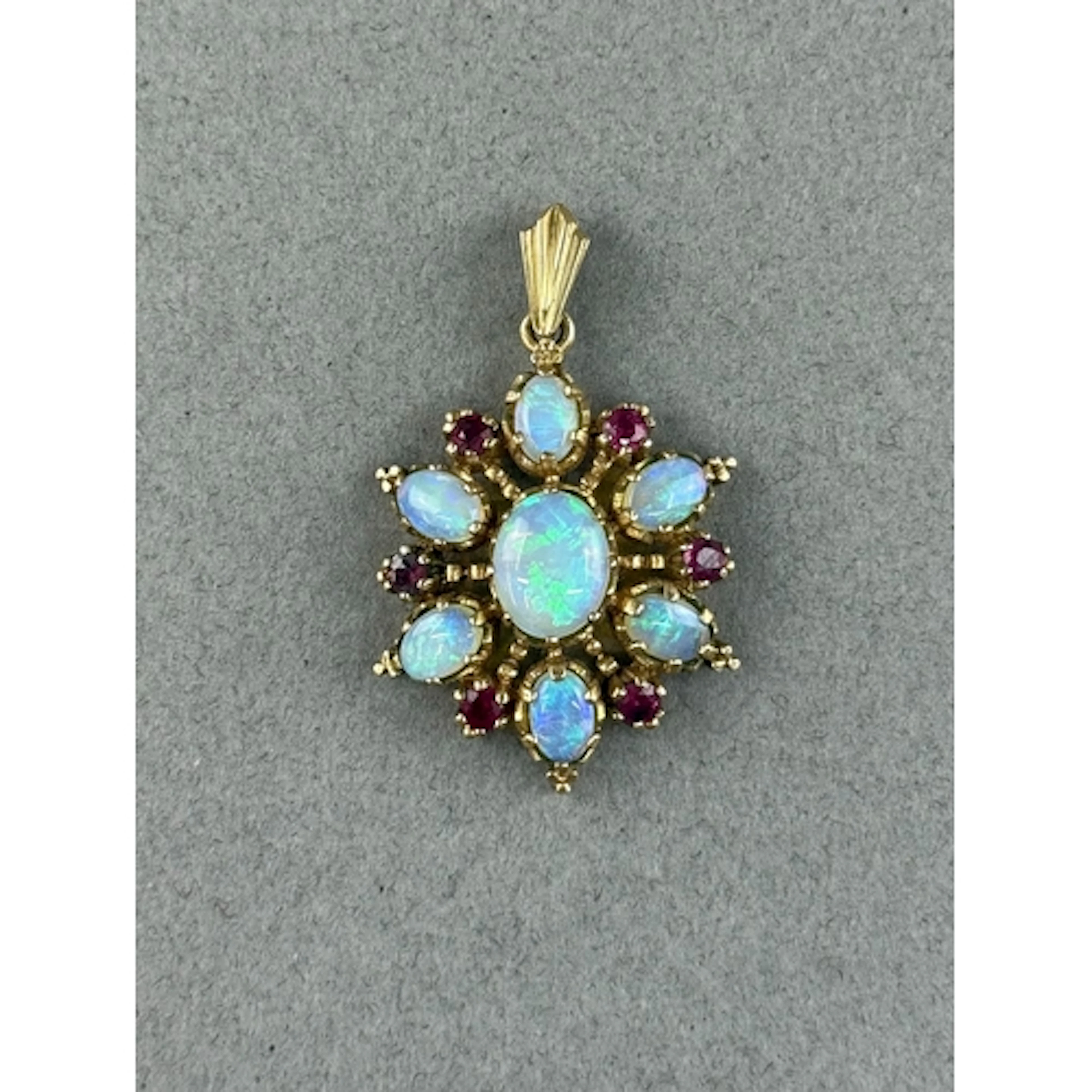 Jewellery: a yellow metal snowflake pendant, marked 375 and ...