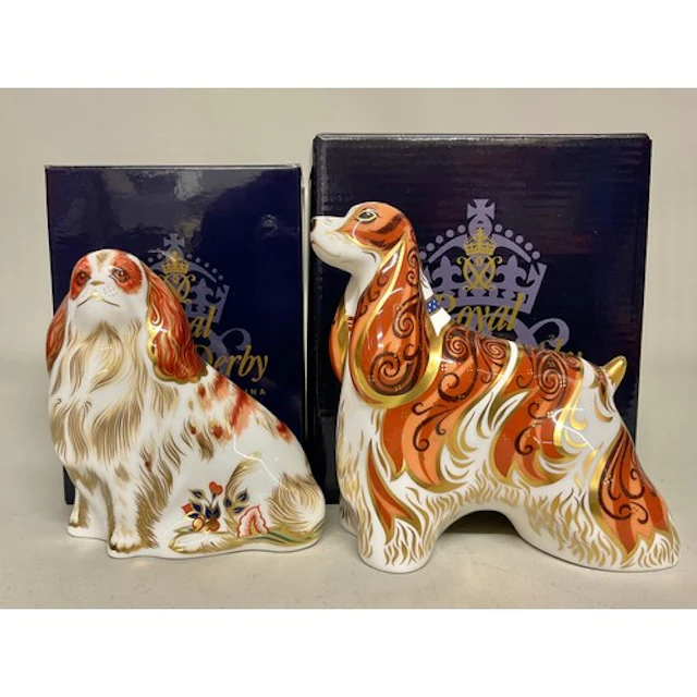 A Royal Crown Derby paperweight, American Spaniel, gold stop...