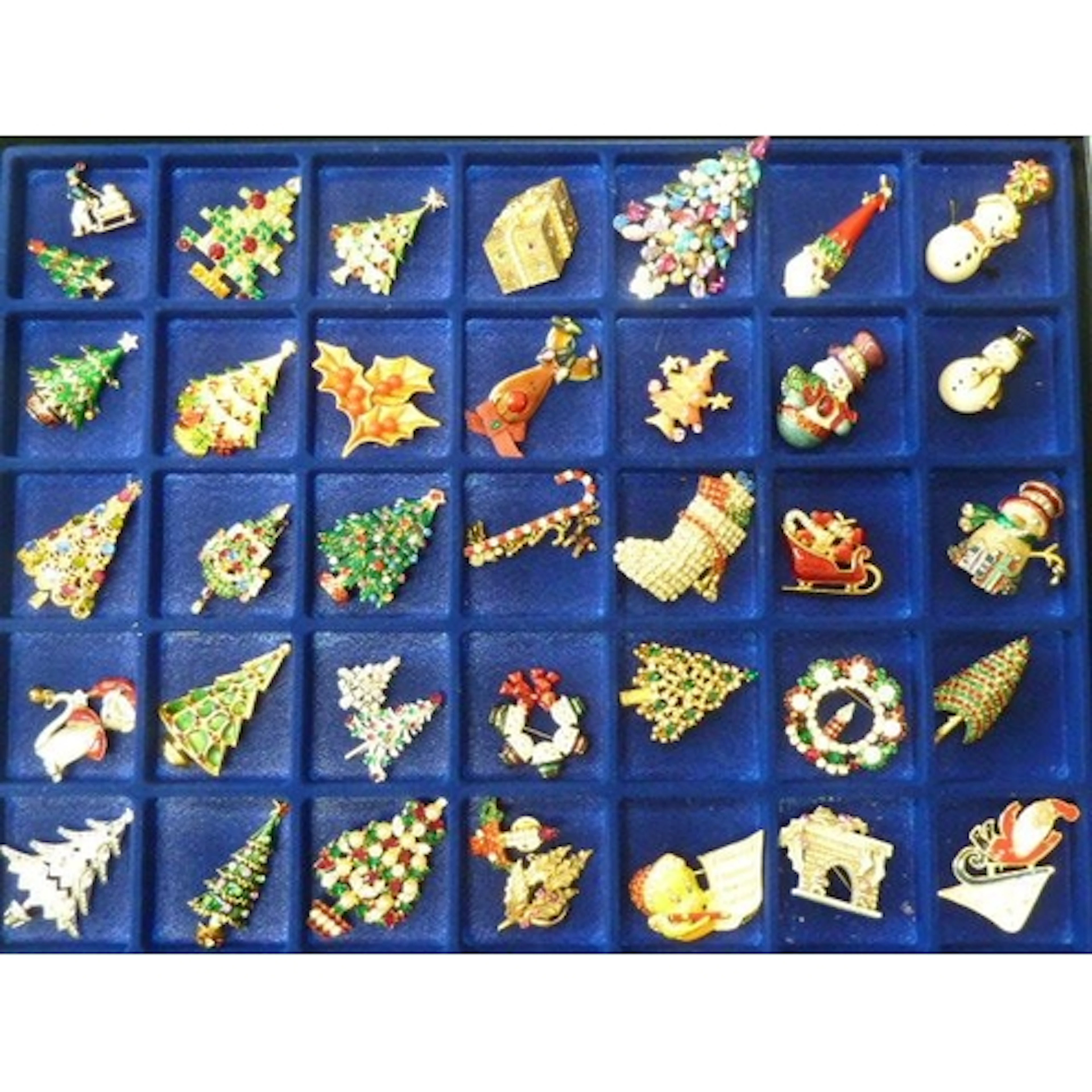 Thirty-eight Christmas brooches, mainly Christmas trees, by ...