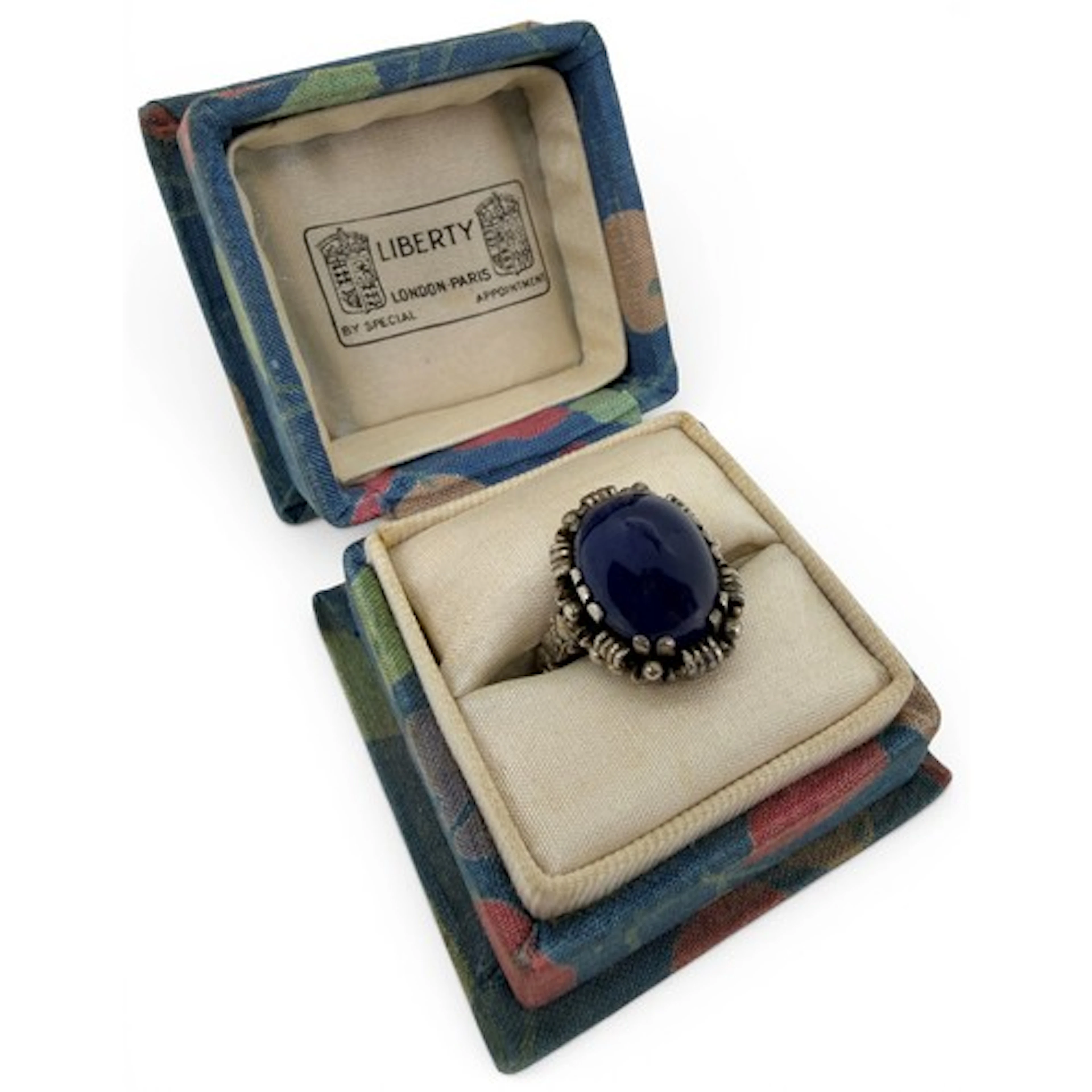 An Edwardian cabochon Burmese star sapphire ring, the single...