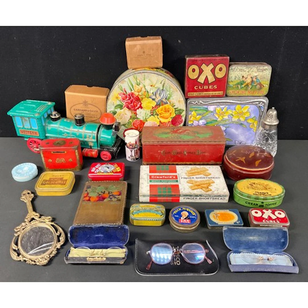 A collection of advertising tins, including Cope Bros. & Co ...