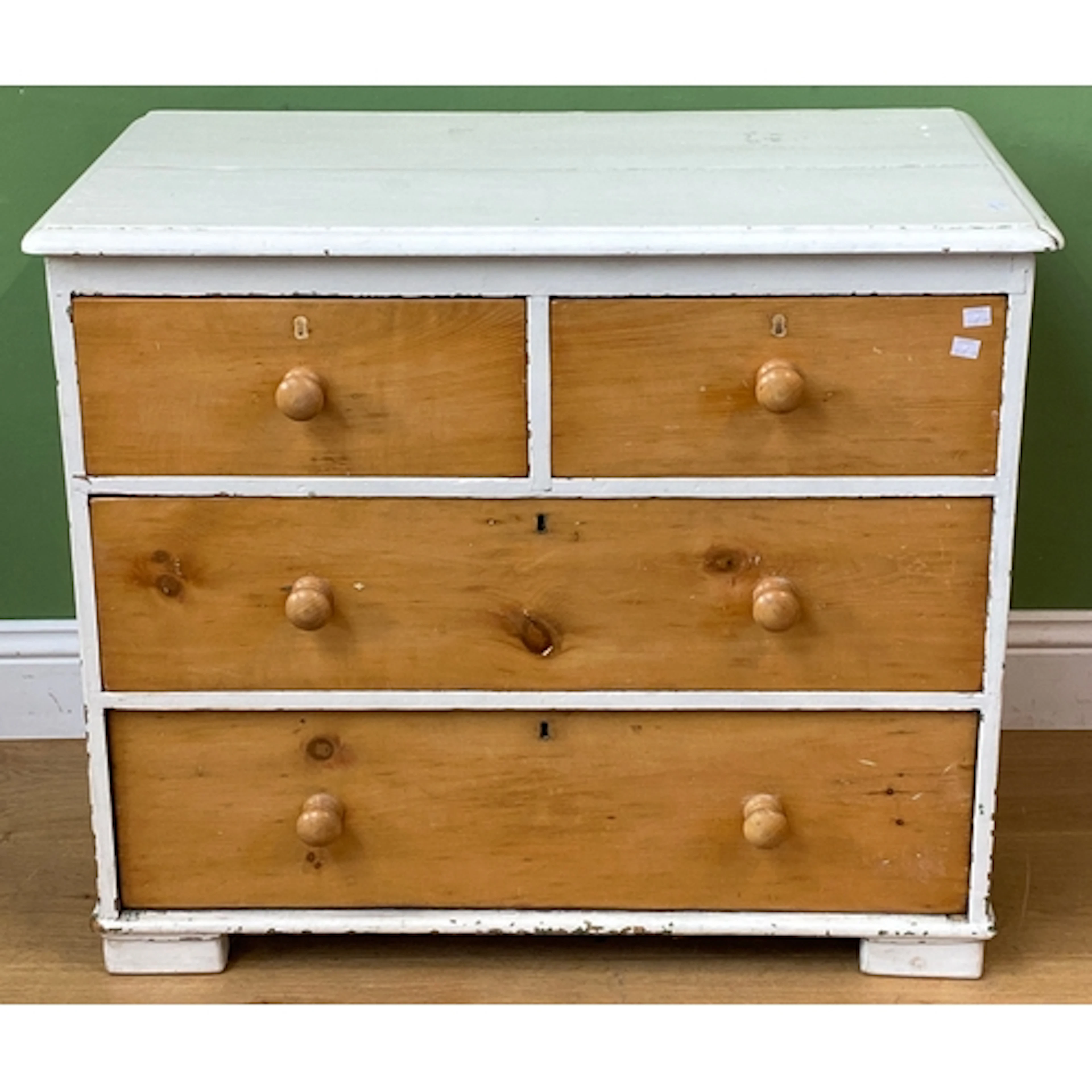 A Victorian pine white painted chest of two short over two l...