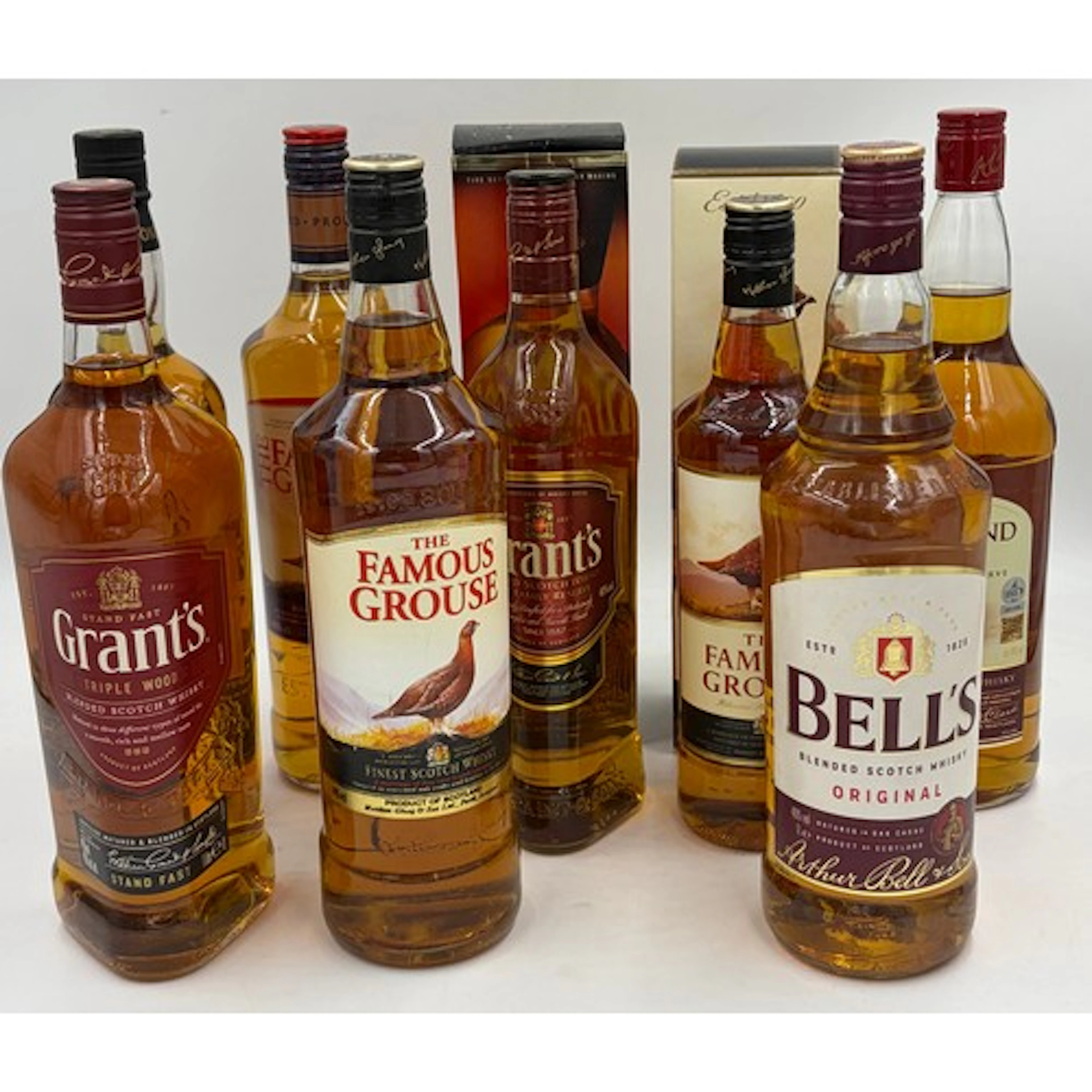 A collection of whisky to include 3 x Famous Grouse Blended ...