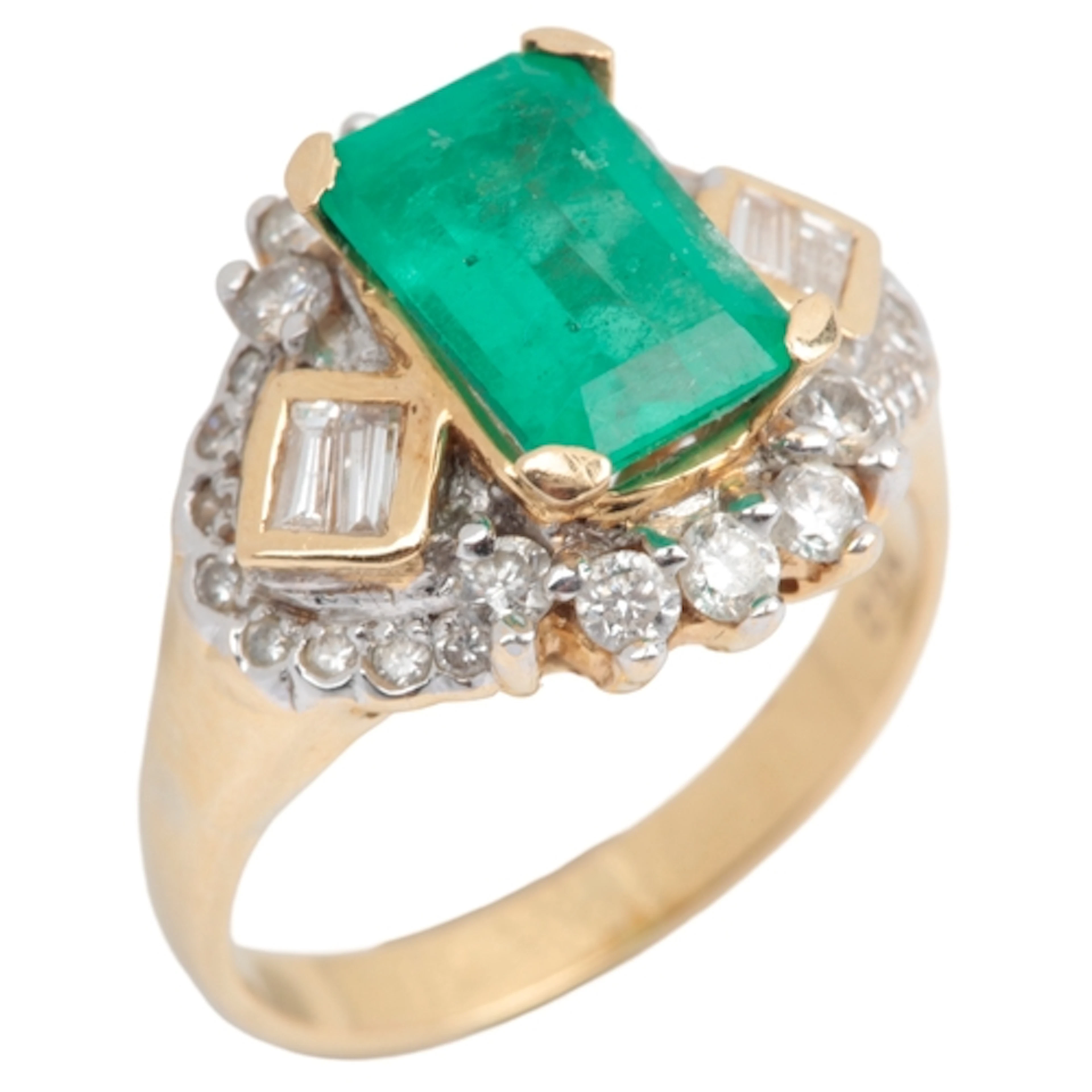 An emerald and diamond ring, claw-set with an emerald measur...