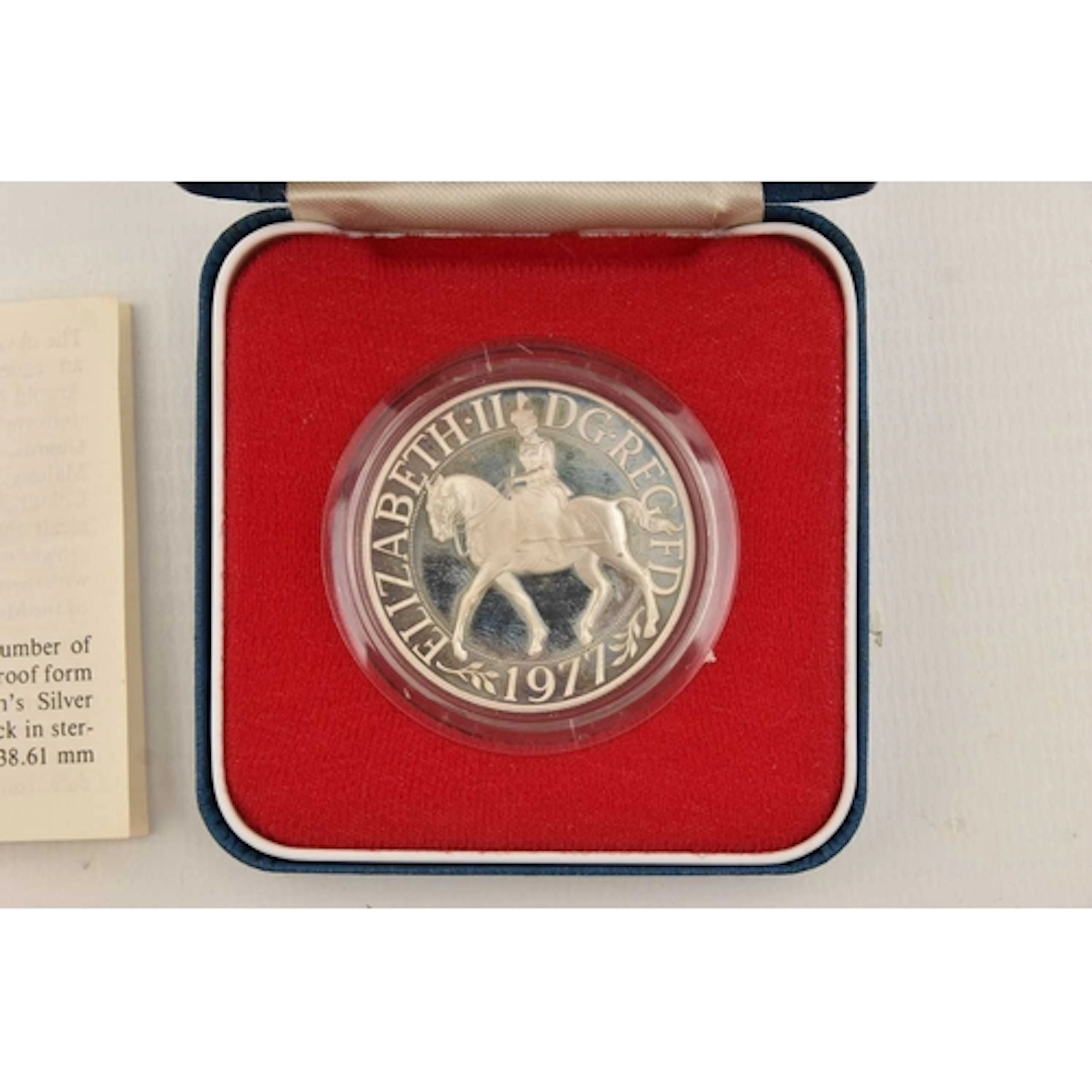 A CASED '6 FEBRUARY 1977' SILVER COMMEMORATIVE CROWN COIN, w...