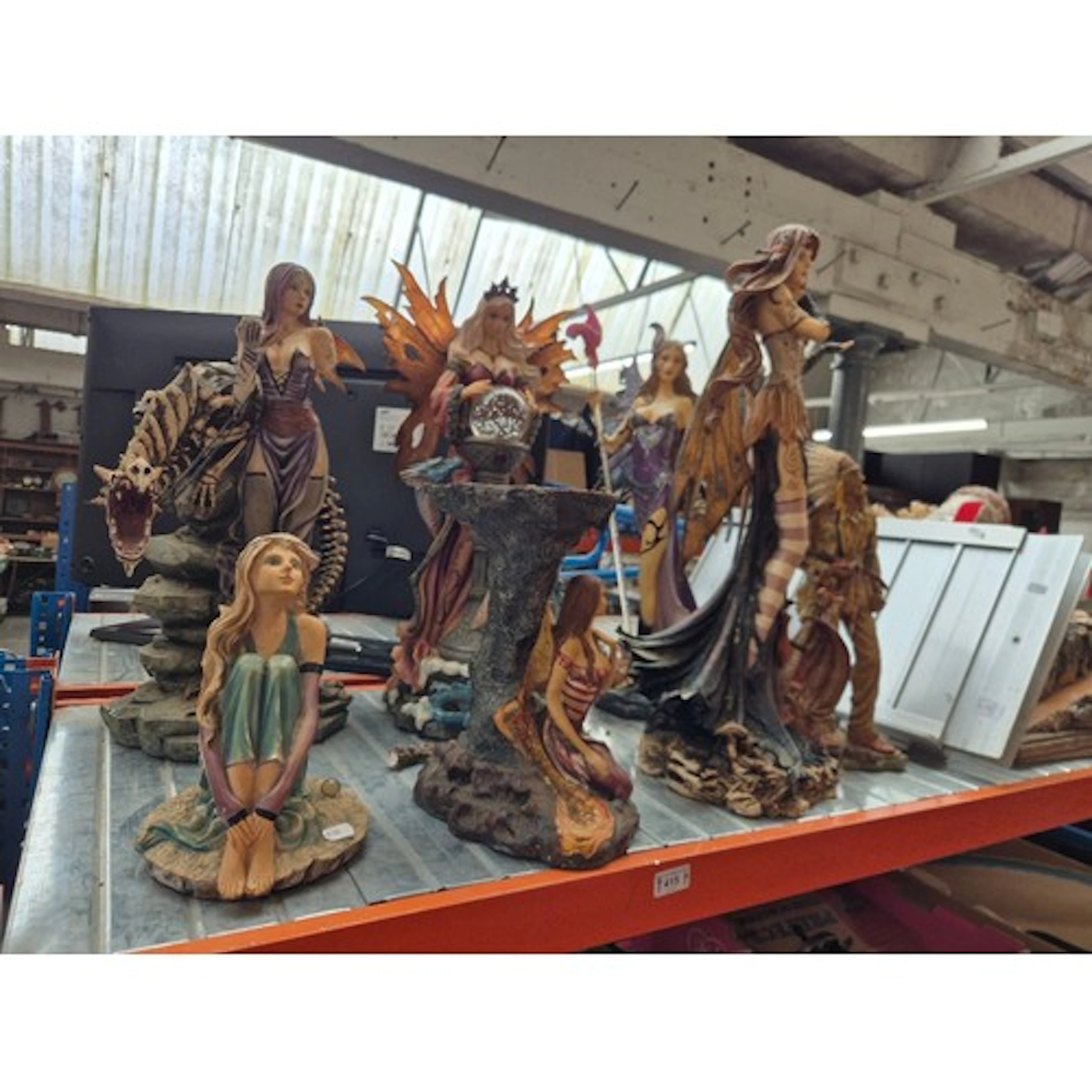 A collection of large Gothic/fantasy style figures including...