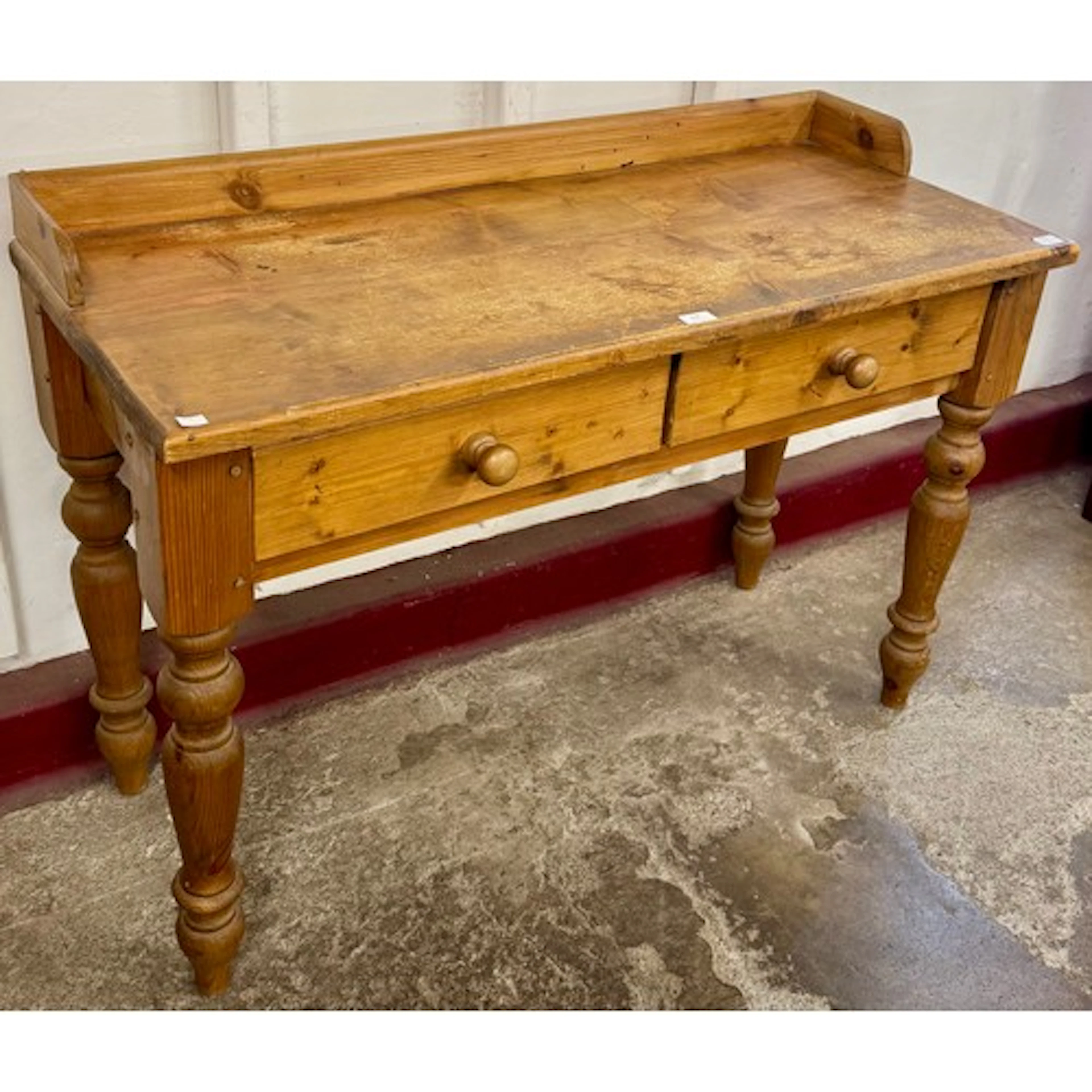 A Victorian style pine two drawer serving table
