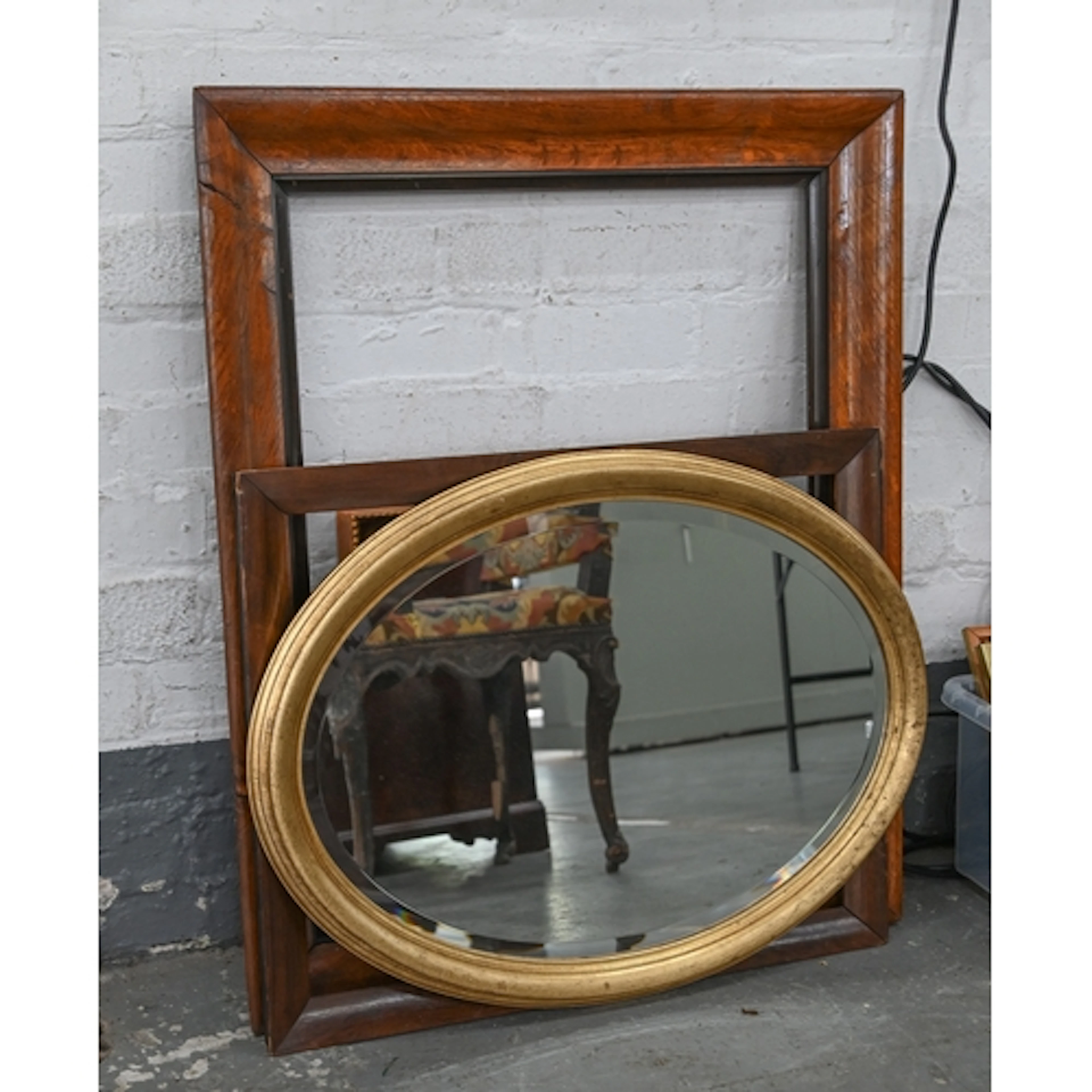 A Victorian oak-grained picture frame, with ebonised slip, s...