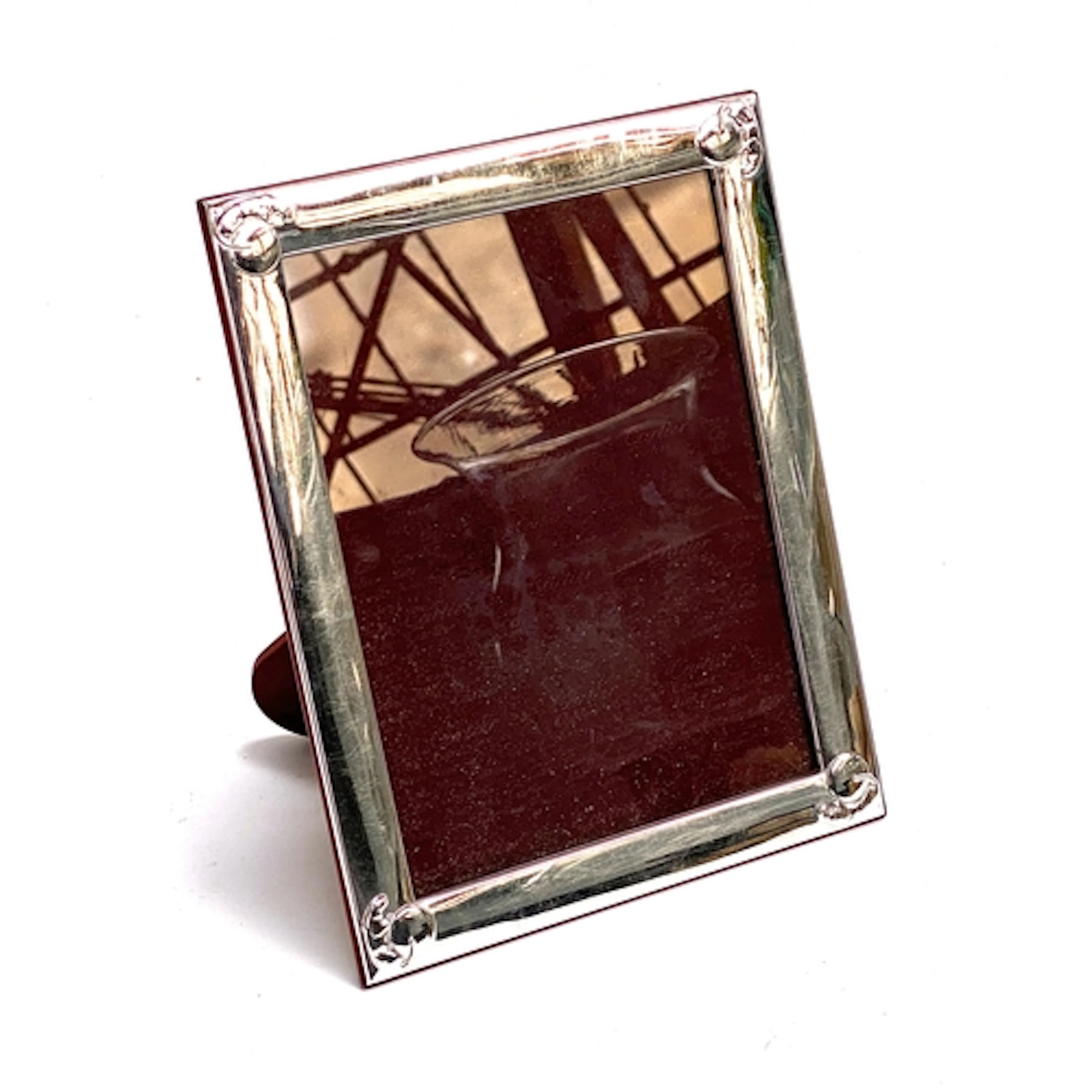 A Cartier 925 silver photo frame, the corners decorated with...