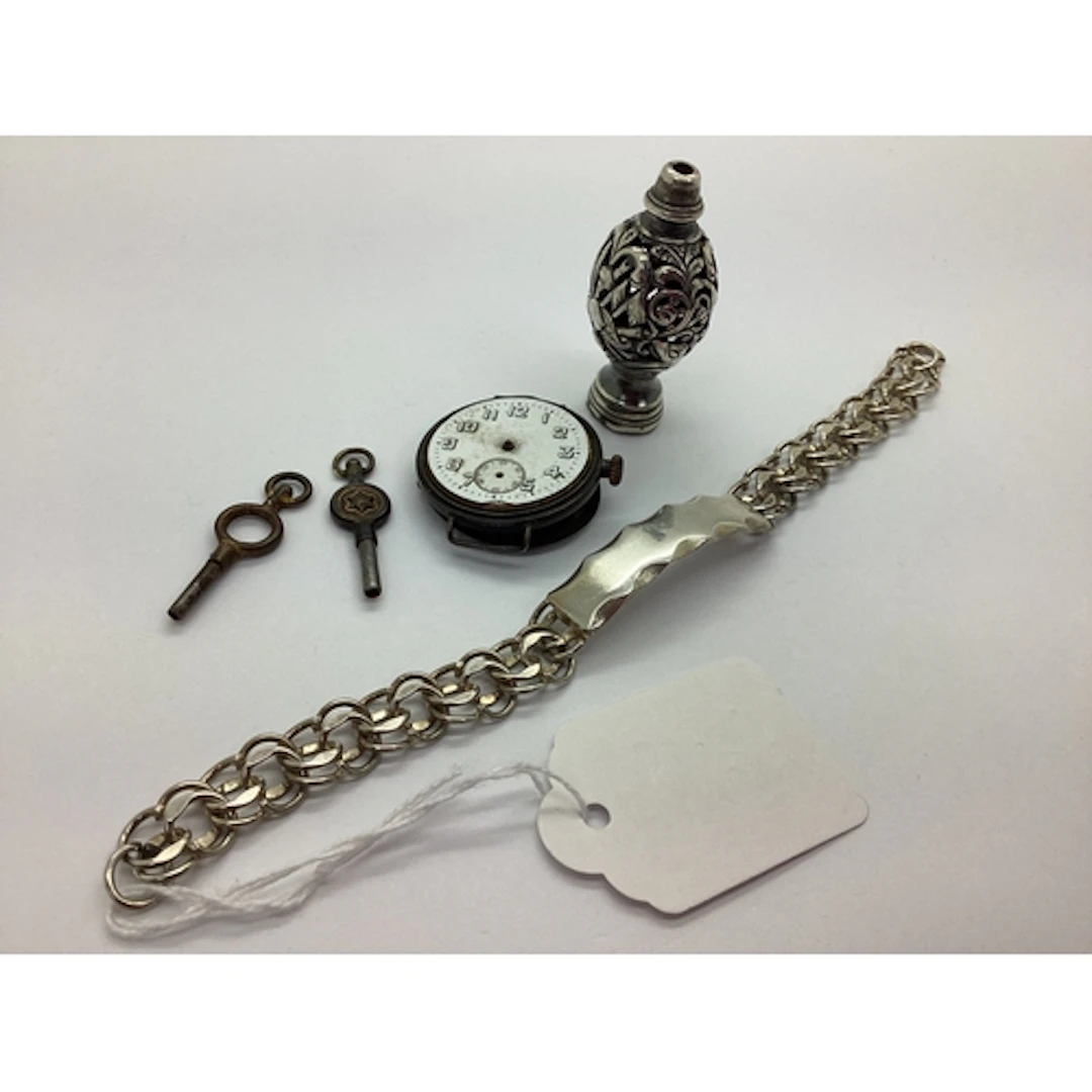 A Hallmarked Silver ID Bracelet, the vacant rectangular pane...
