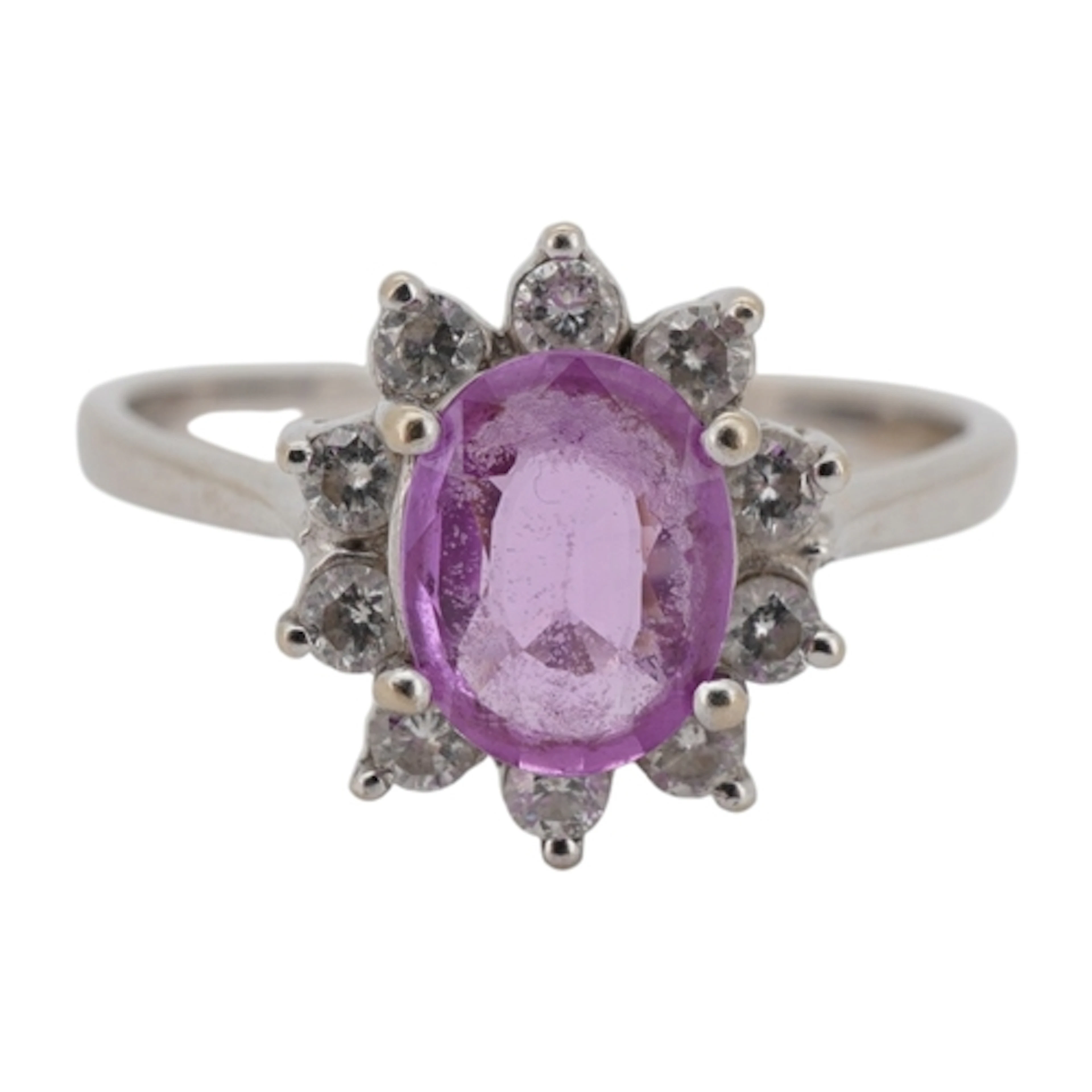 An 18k white metal, pink sapphire and diamond set oval clust...