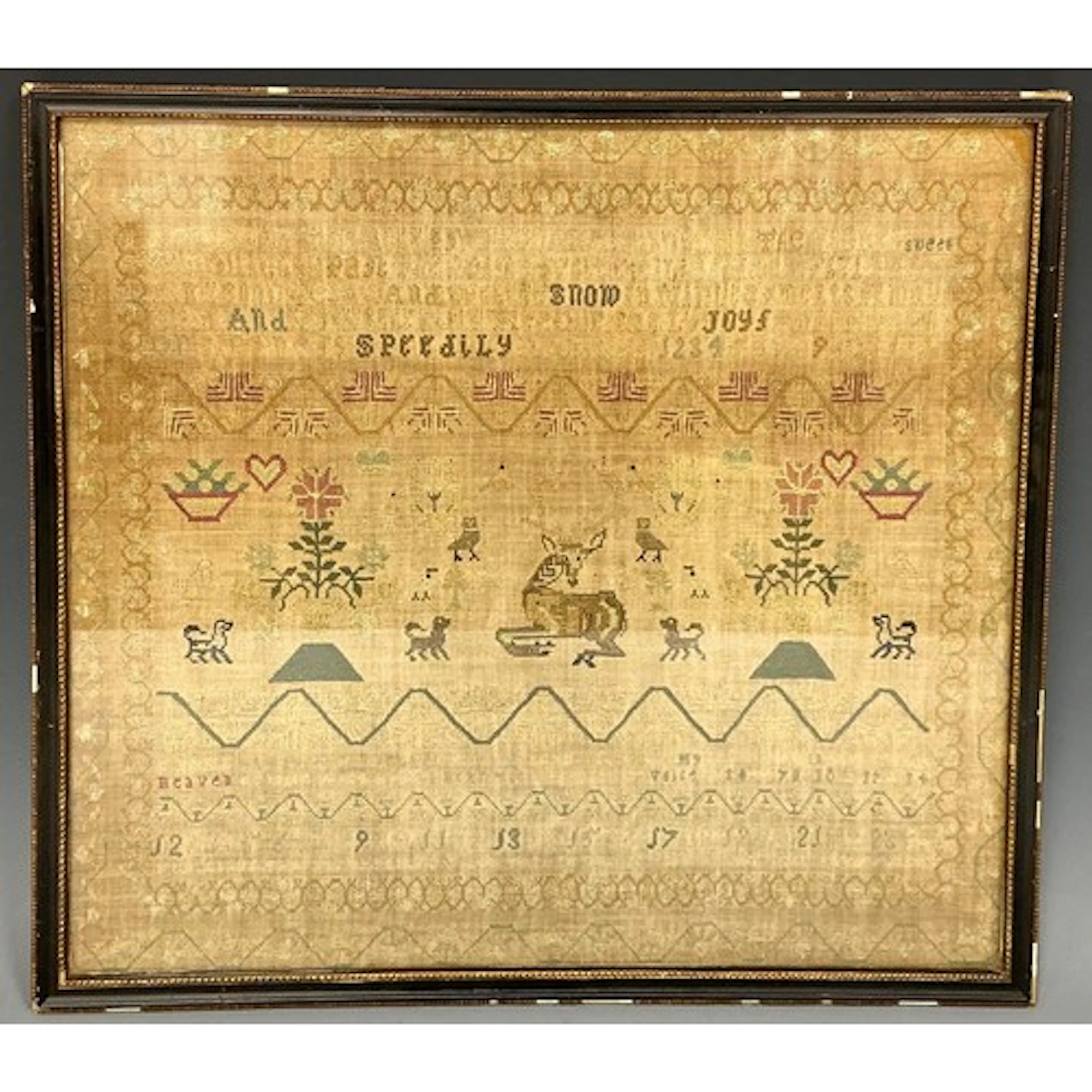 A George III needlework sampler, worked on linen in coloured...