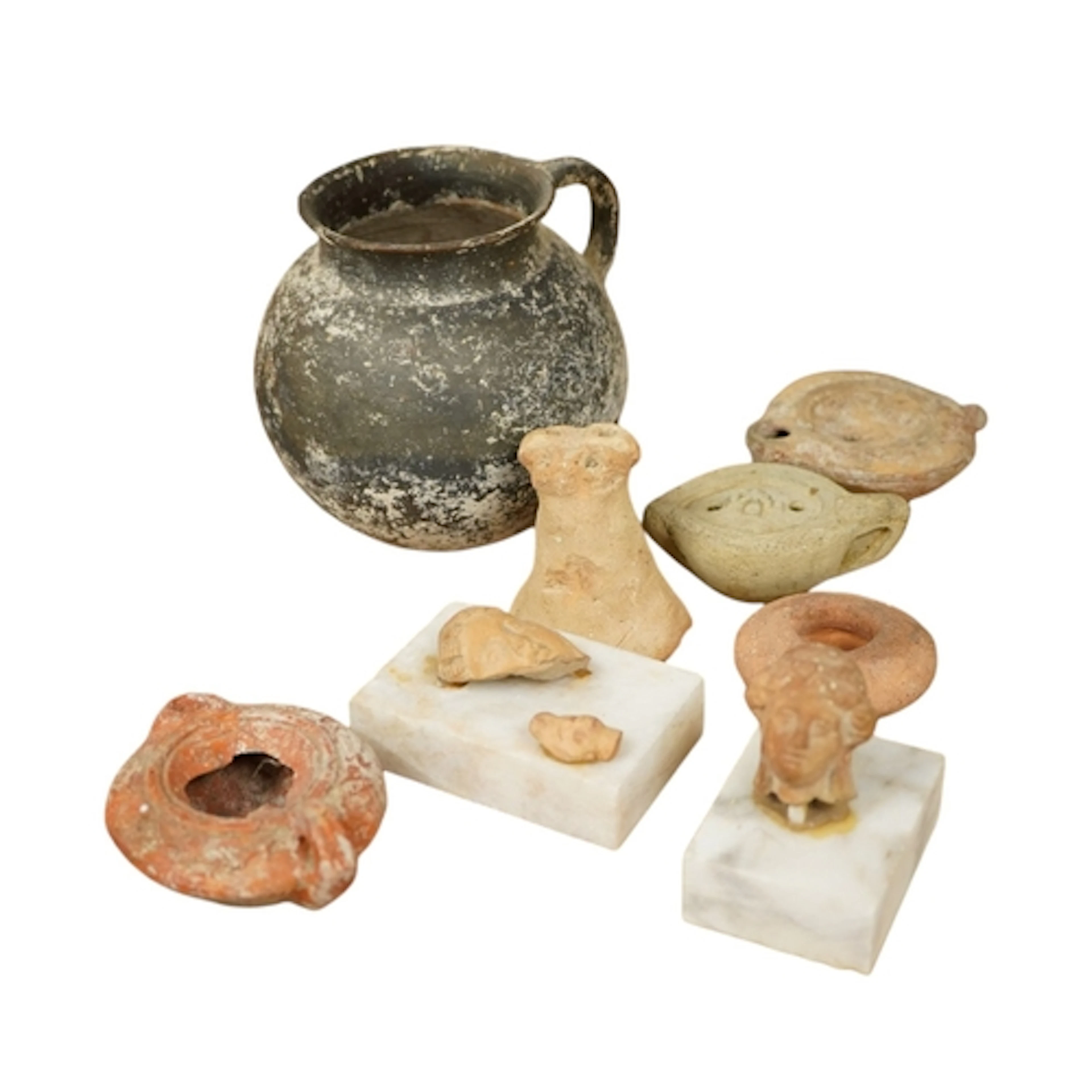 A group of miniature Roman relics, to include a bust of a la...