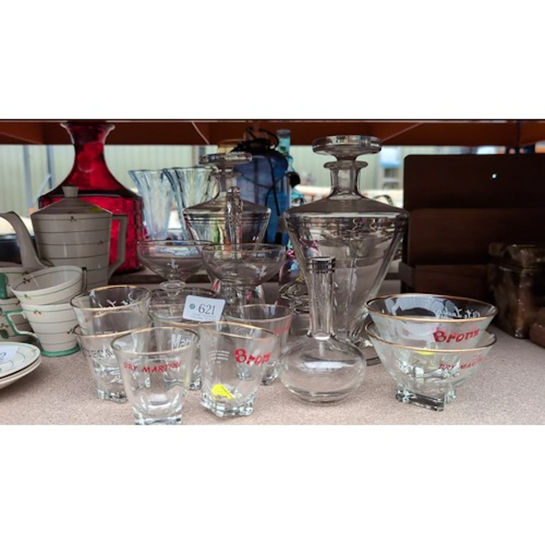 A collection of cocktail glassware including stoppered decan...