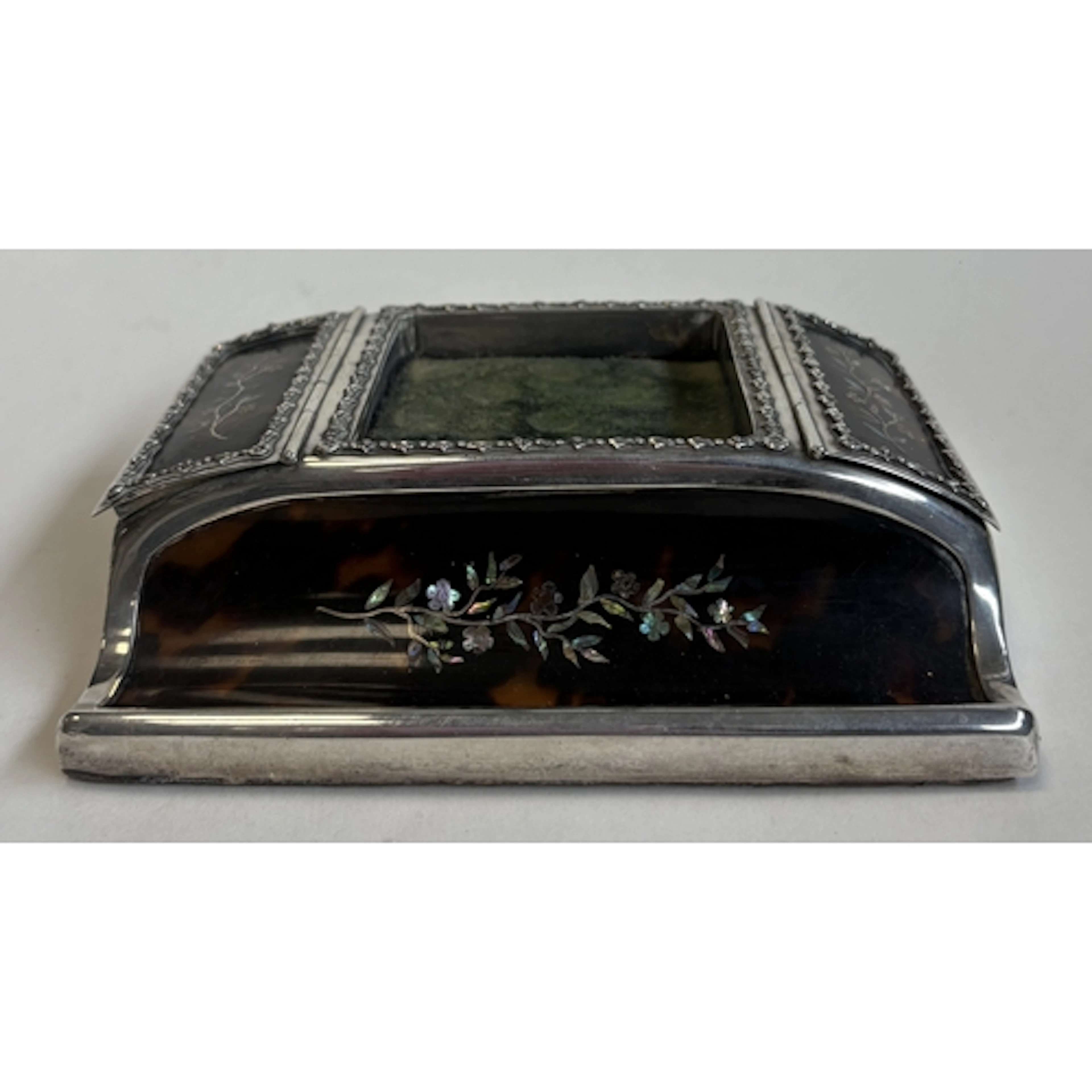 A novelty silver and faux tortoiseshell combination stamp ho...