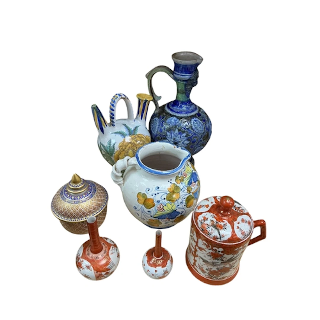 Two Maiolica style pottery jugs, larger 25cm, a Kutani lidde...