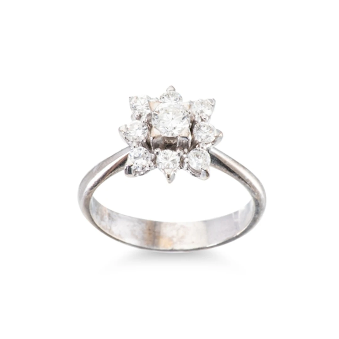 A DIAMOND CLUSTER RING, the brilliant cut diamonds mounted i...