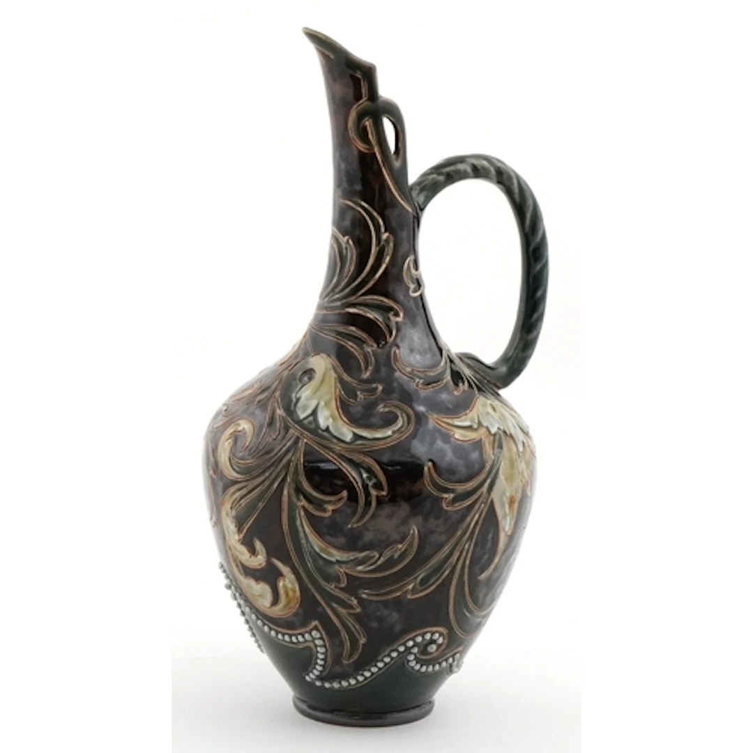 Doulton Lambeth Art Nouveau stoneware jug with incised leave...