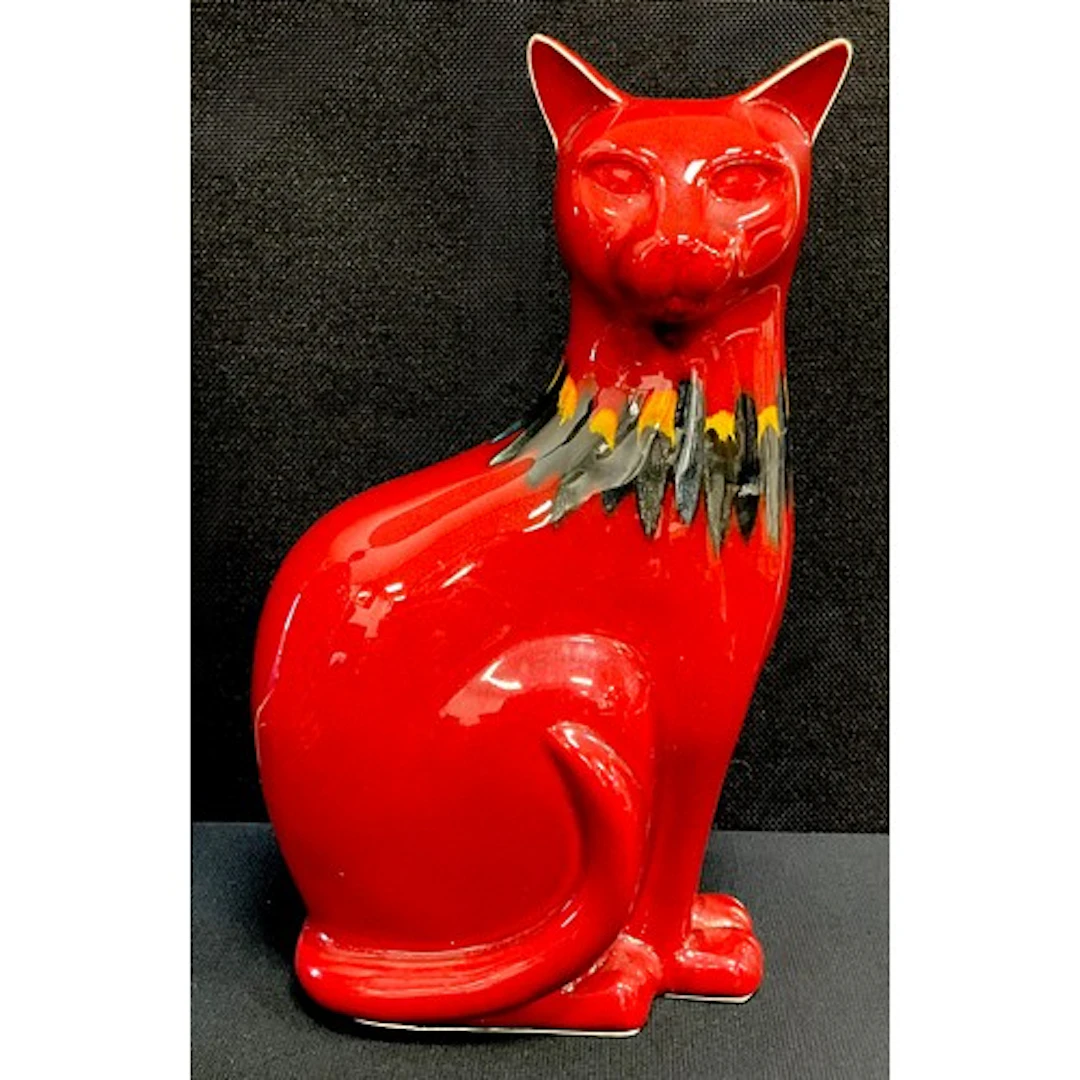 A Poole Pottery red flambe Delphis figure of a sitting cat, ...