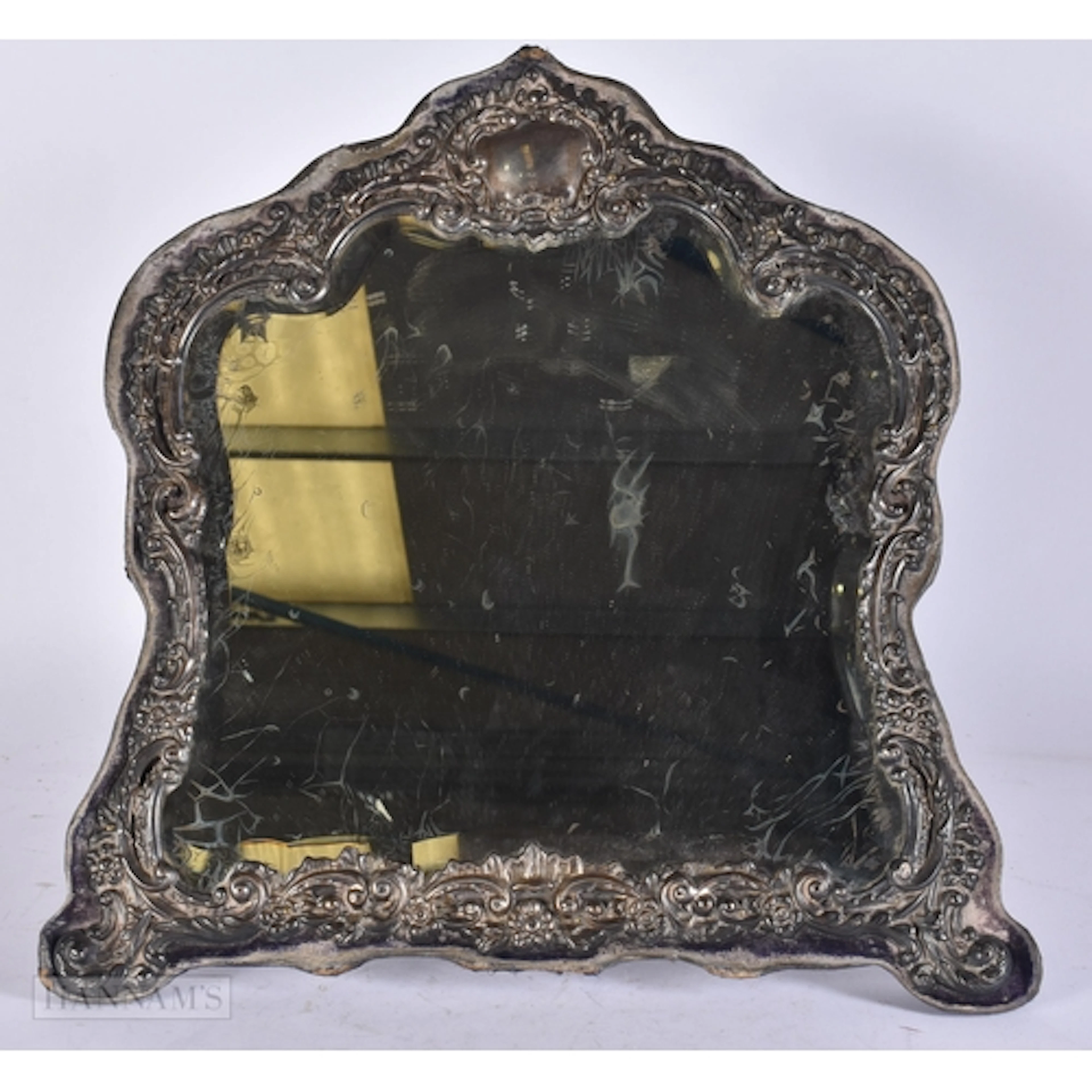 AN ANTIQUE SILVER REPOUSSE MIRROR. 35 cm x 30 cm.