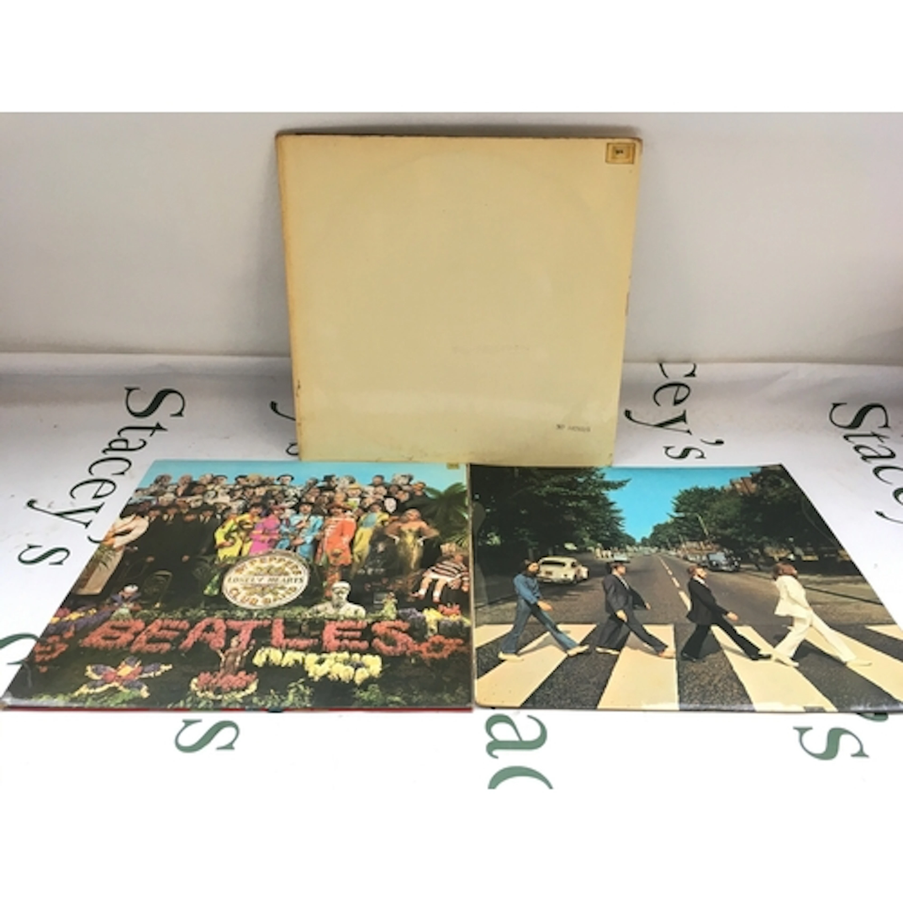 Three early UK pressings of Beatles LPs comprising a numbere...