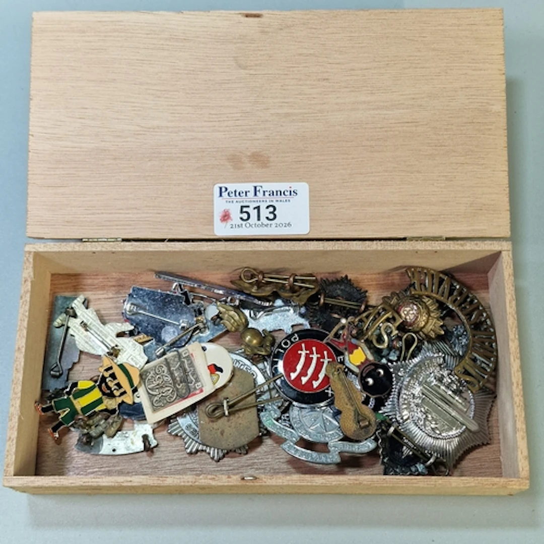Cigar box comprising a collection of Military and other badg...