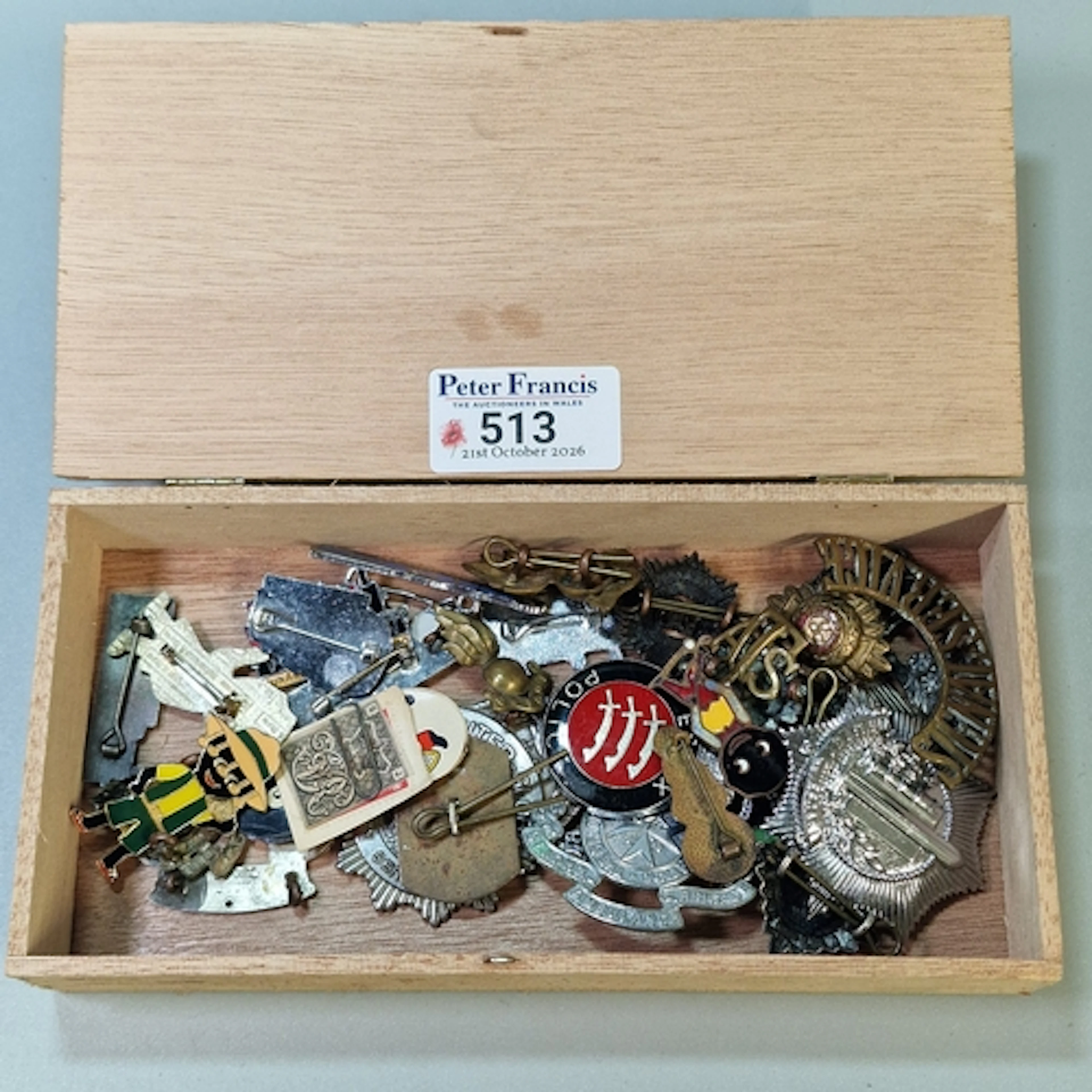 Cigar box comprising a collection of Military and other badg...