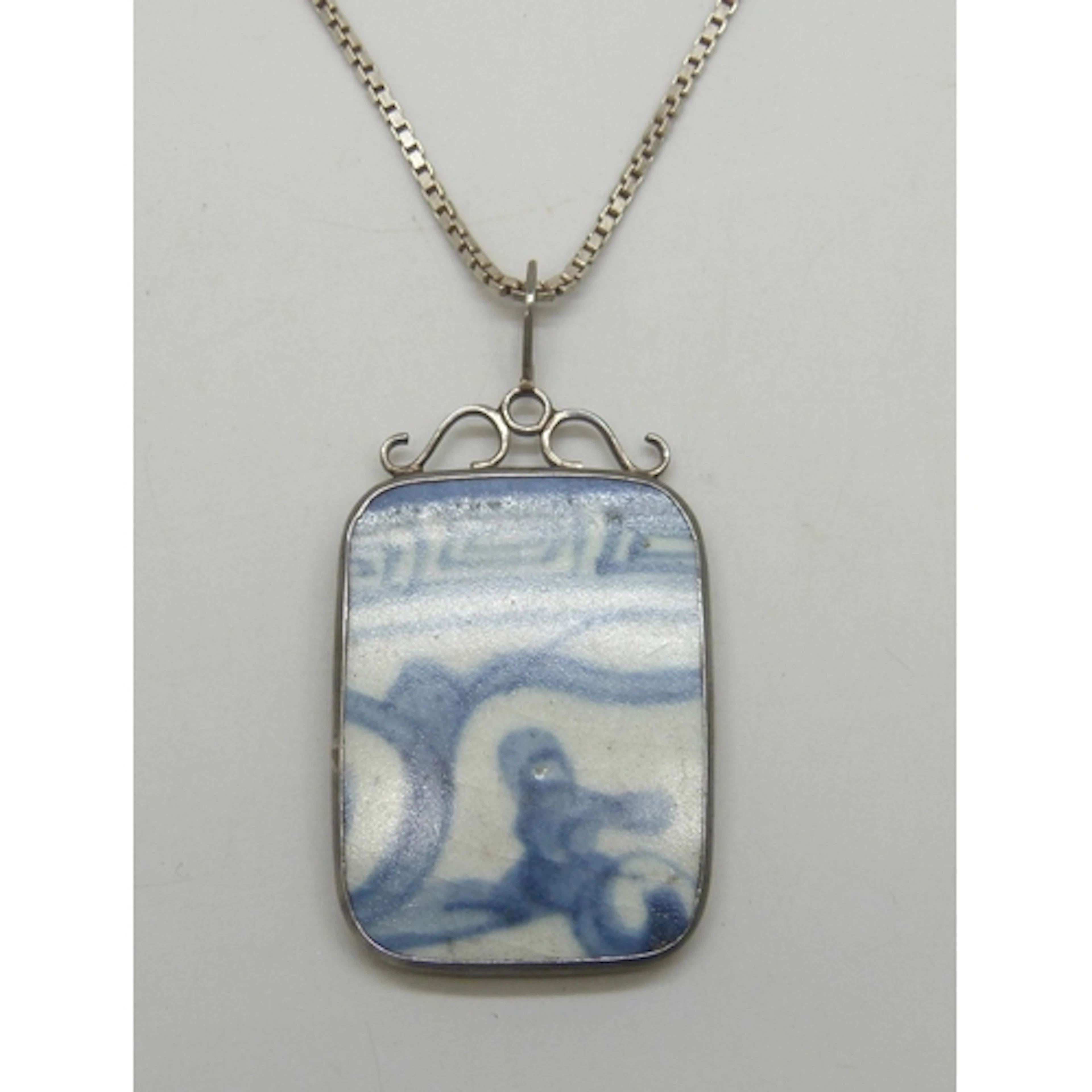A Chinese blue and white ceramic plaque in a silver mount, 6...