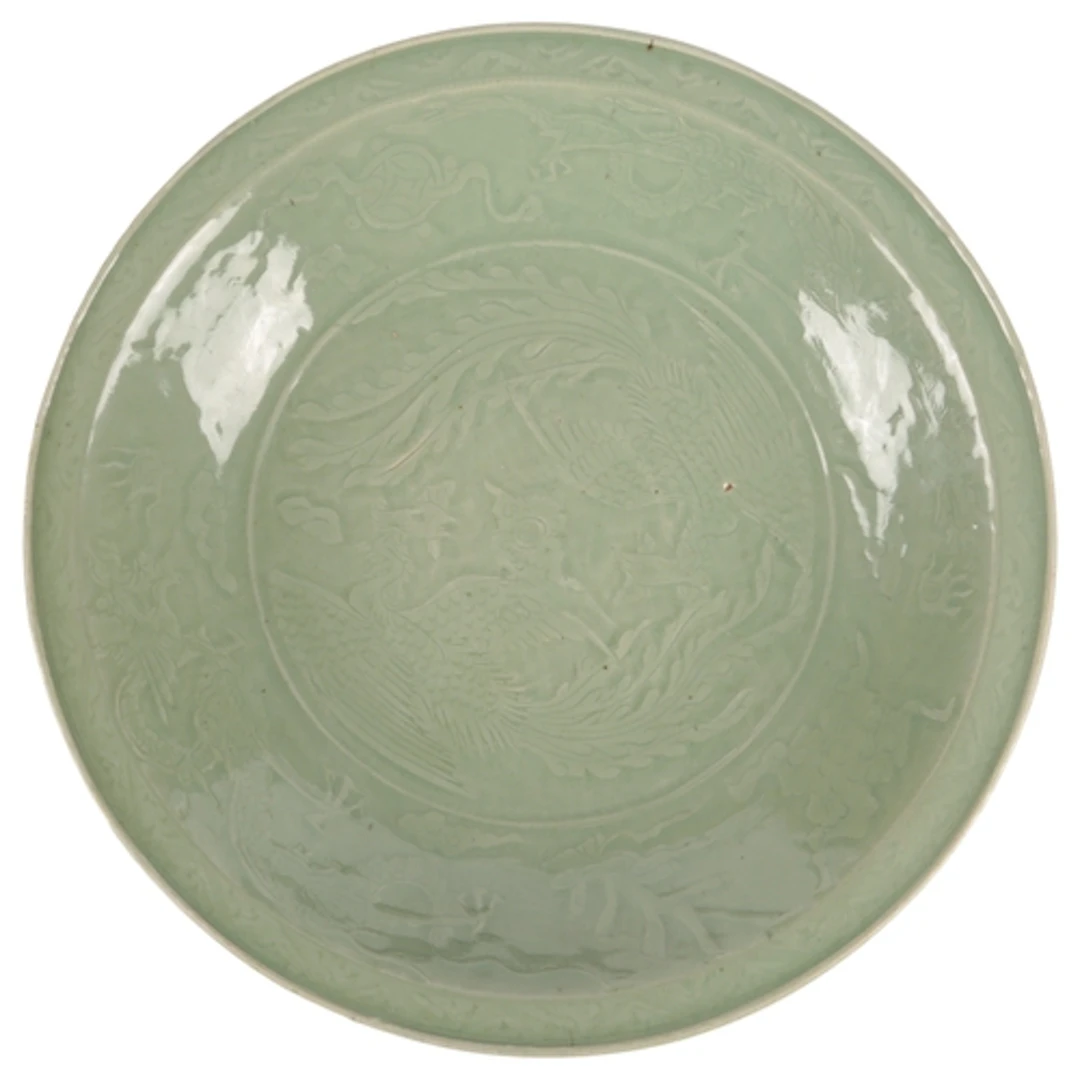 A large Chinese Ming Longquan carved celadon 'Phoenix and dr...